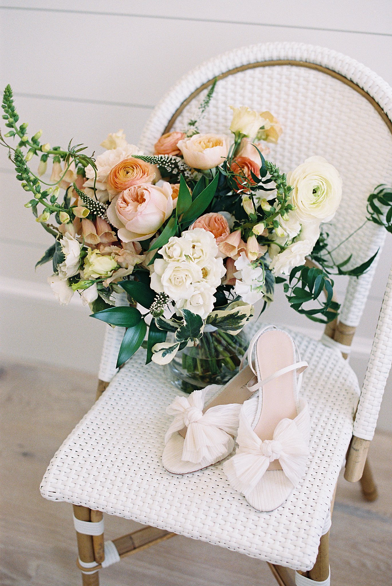 bride's shows sit next to her bouquet by Lynne Reznick Photography