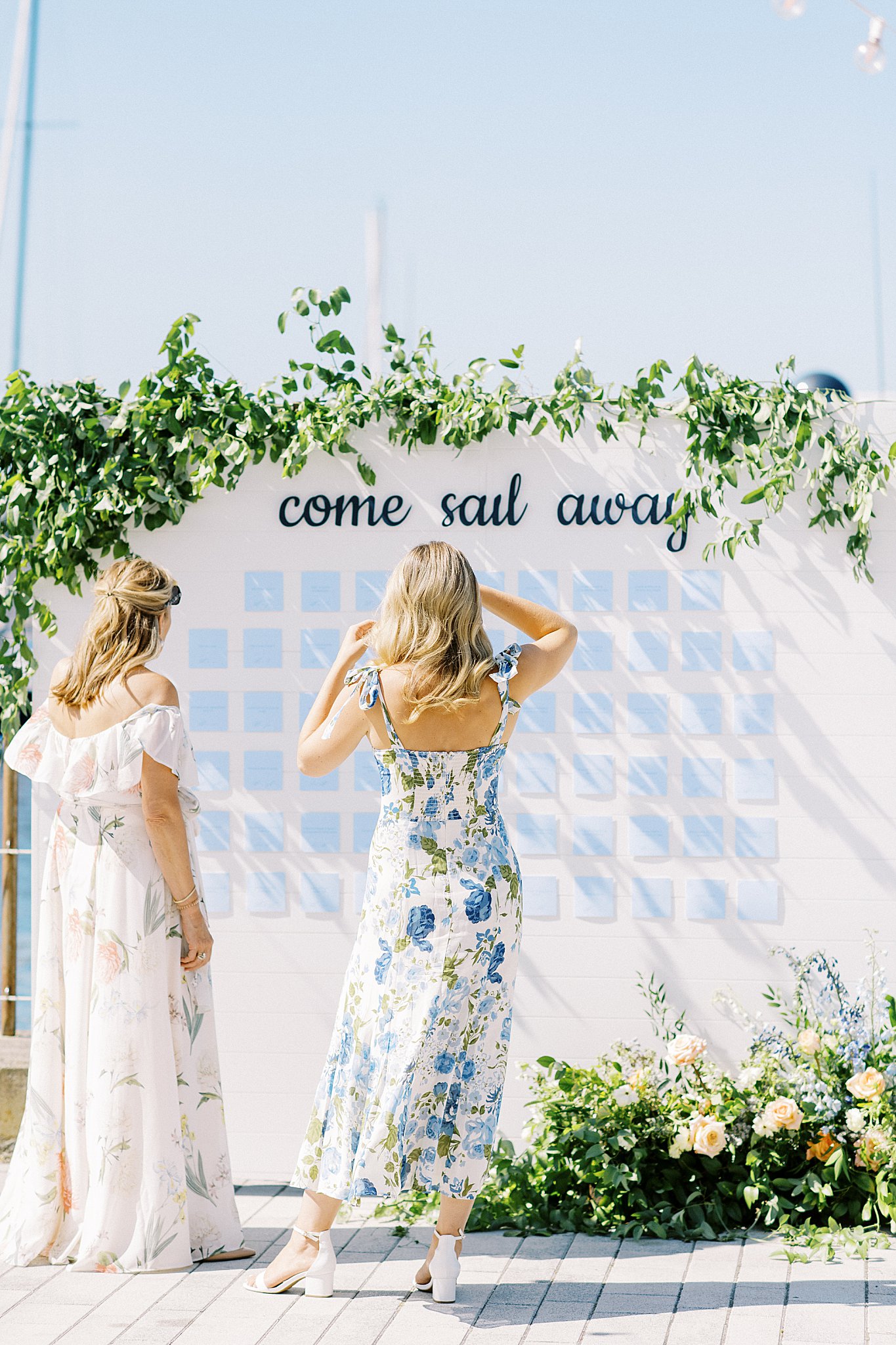 guests look for their name to find their table by Lynne Reznick Photography