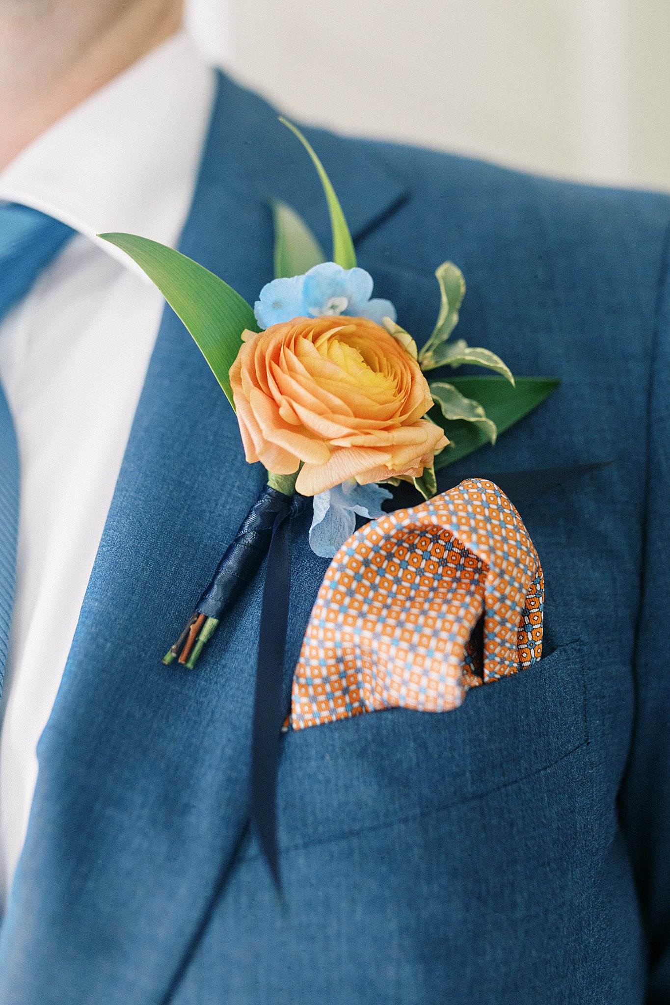 groom's boutonniere on his lapel by Boston wedding photographer