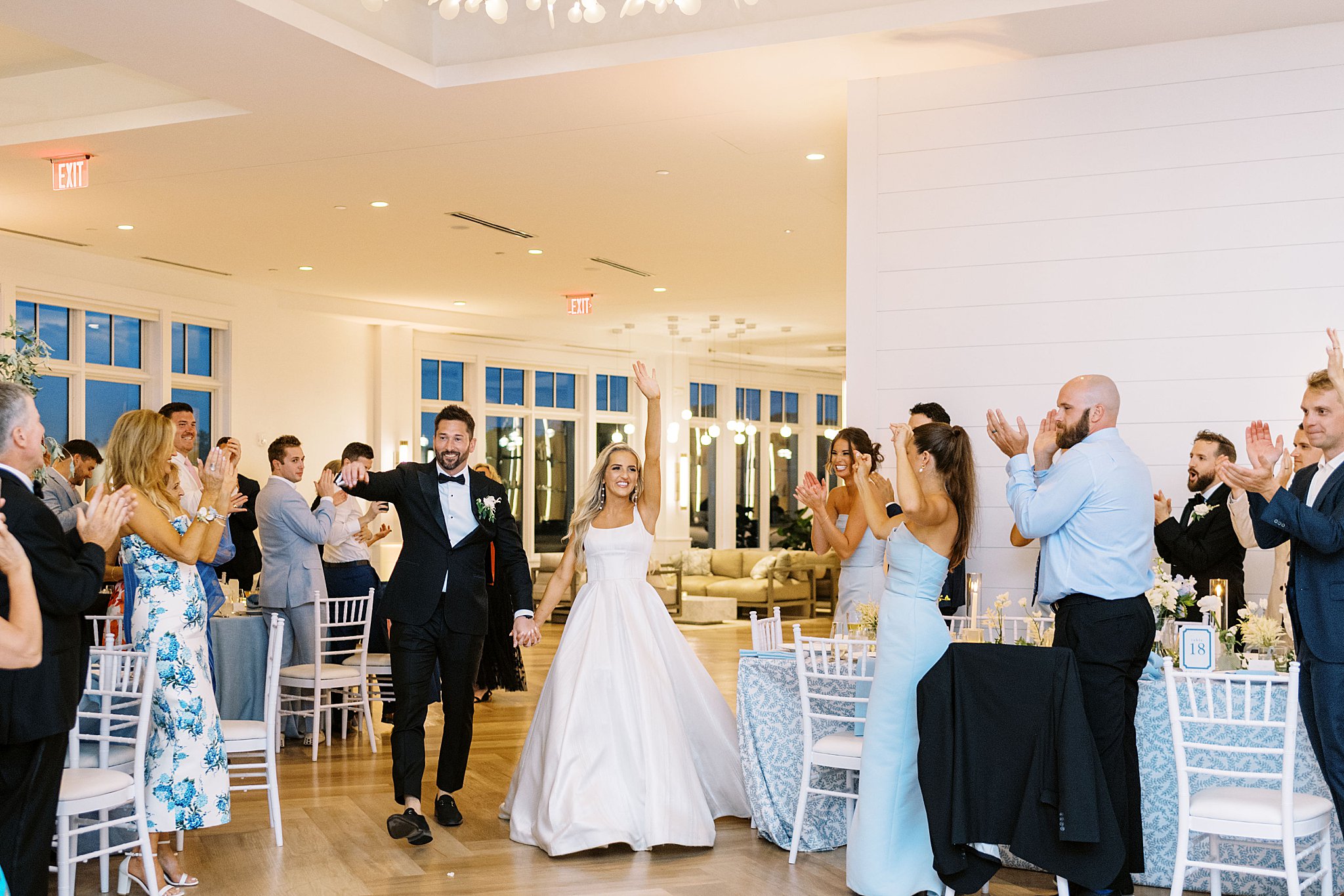 newlyweds enter reception before their first dance