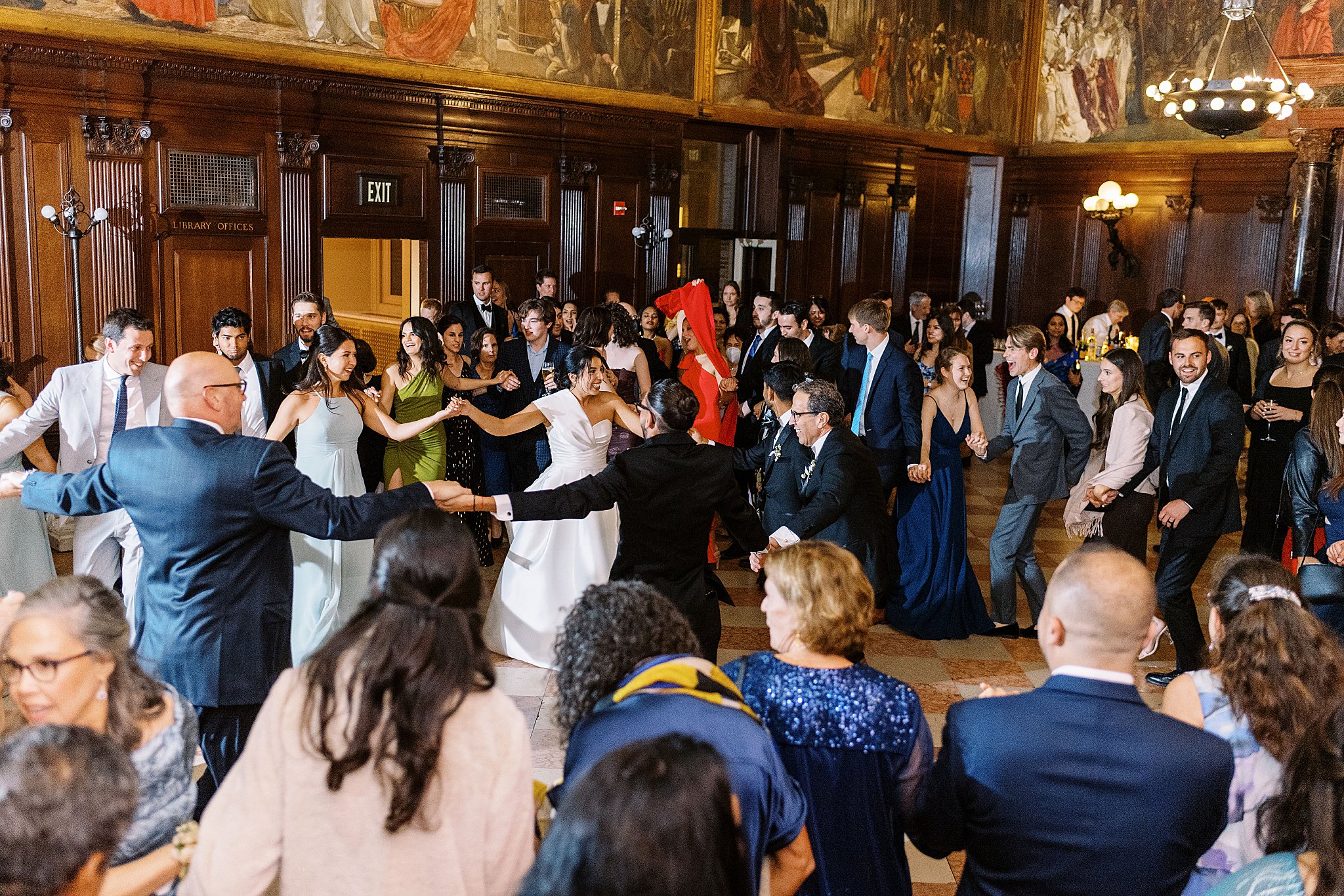 guests join couple on the dance floor by Lynne Reznick Photography