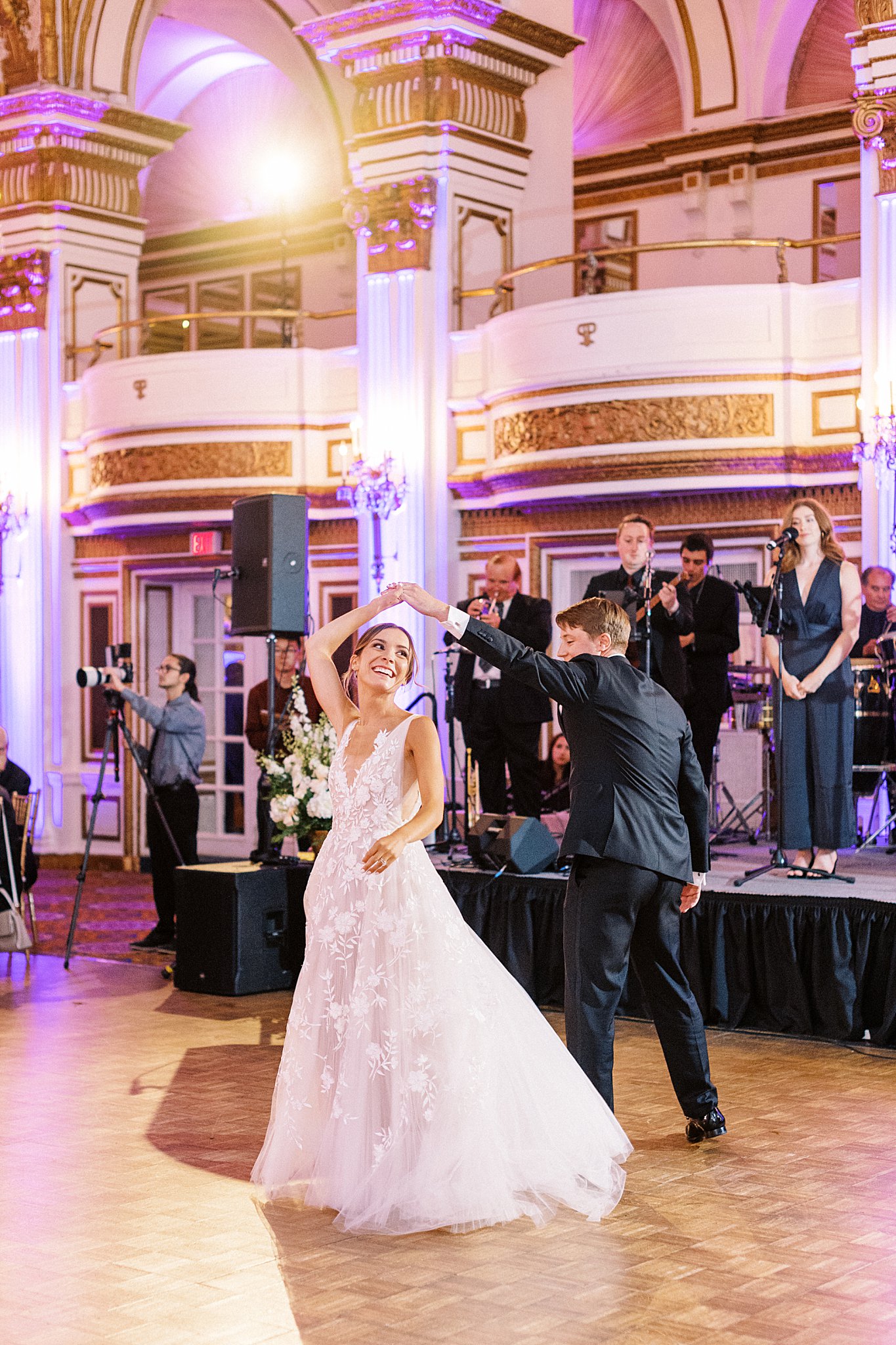 groom spins bride by Boston wedding photographer