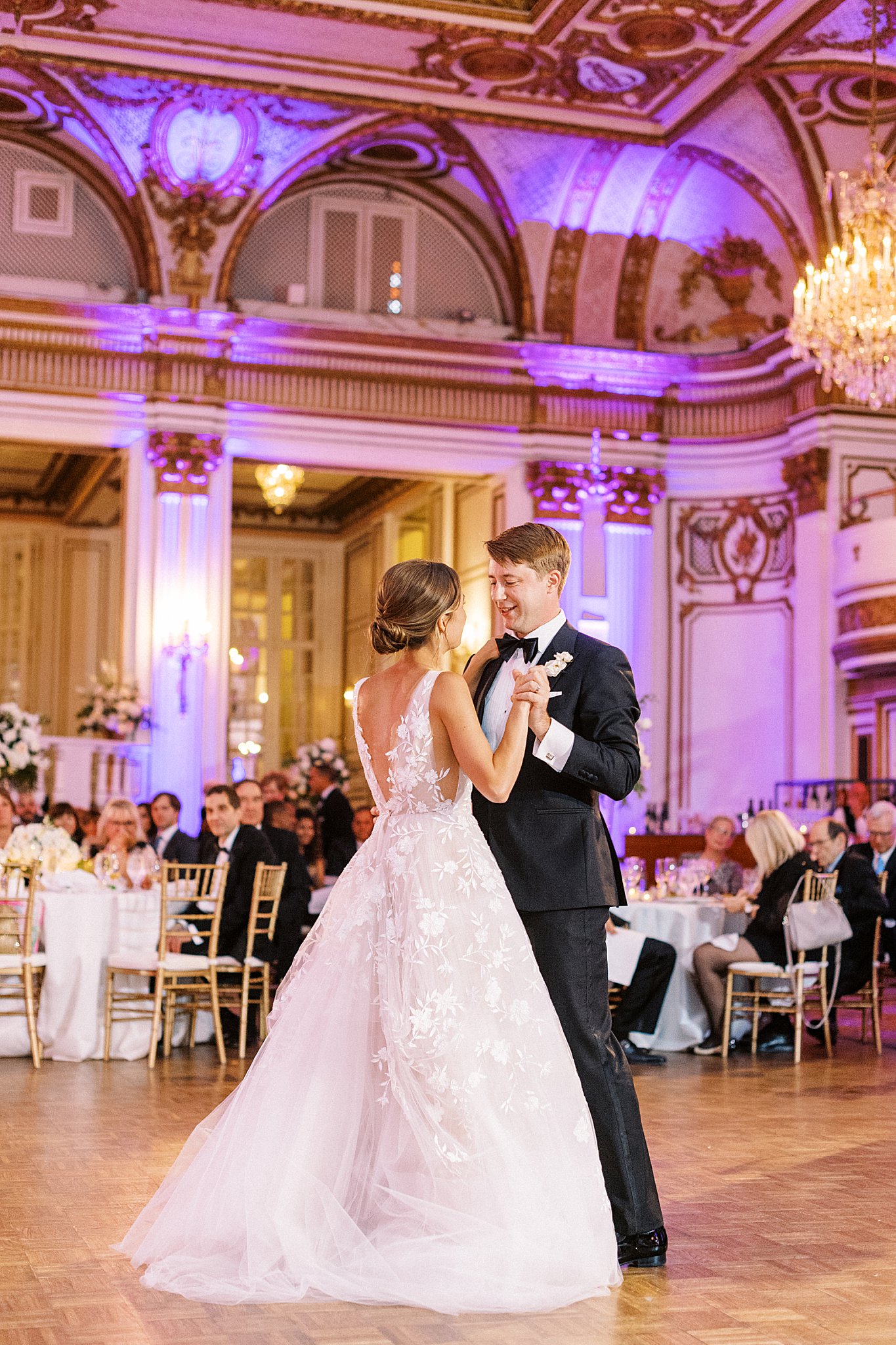 guests watch as couple shares intimate dance by Lynne Reznick Photography