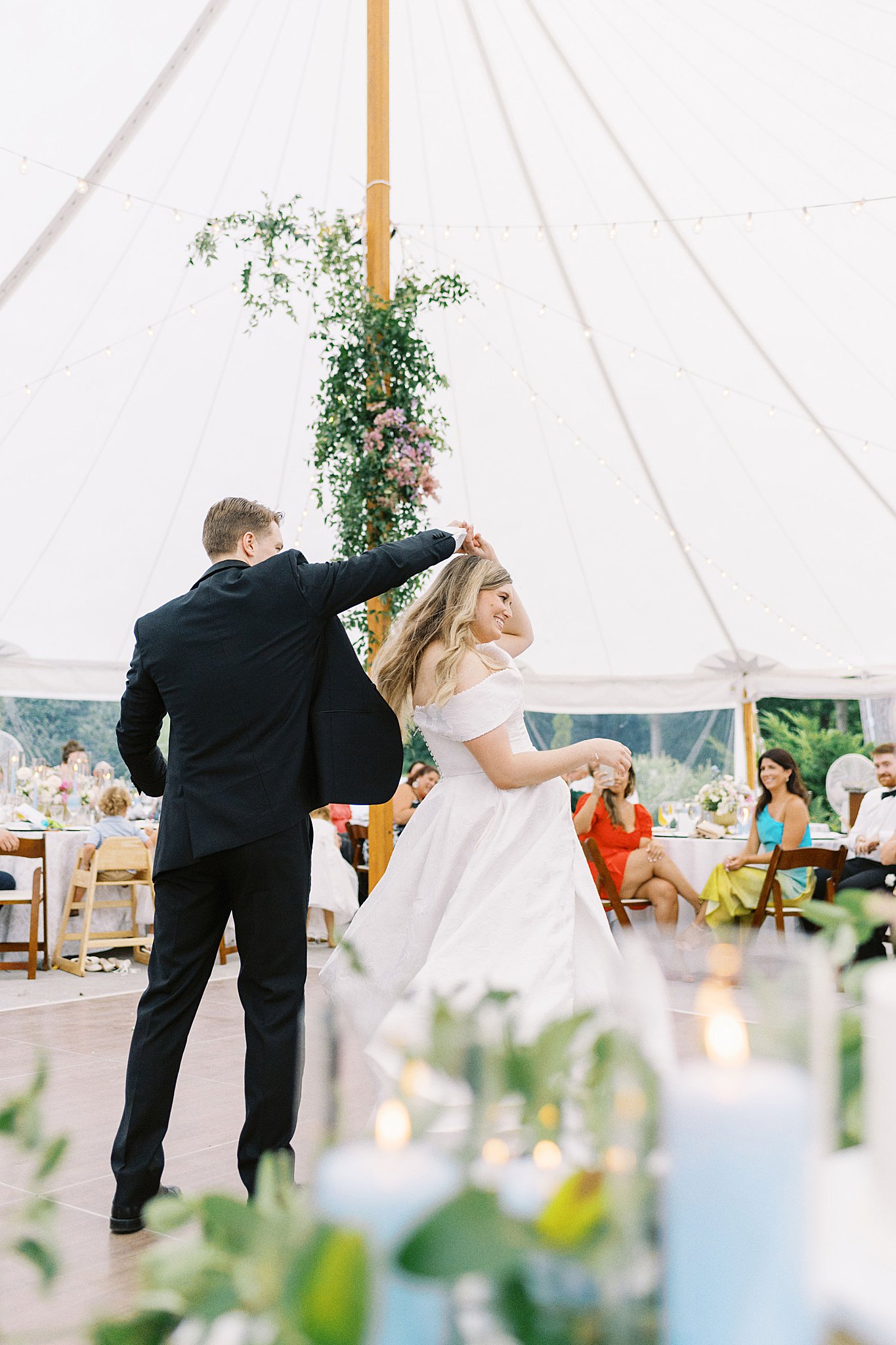 groom spins bride during their first dance