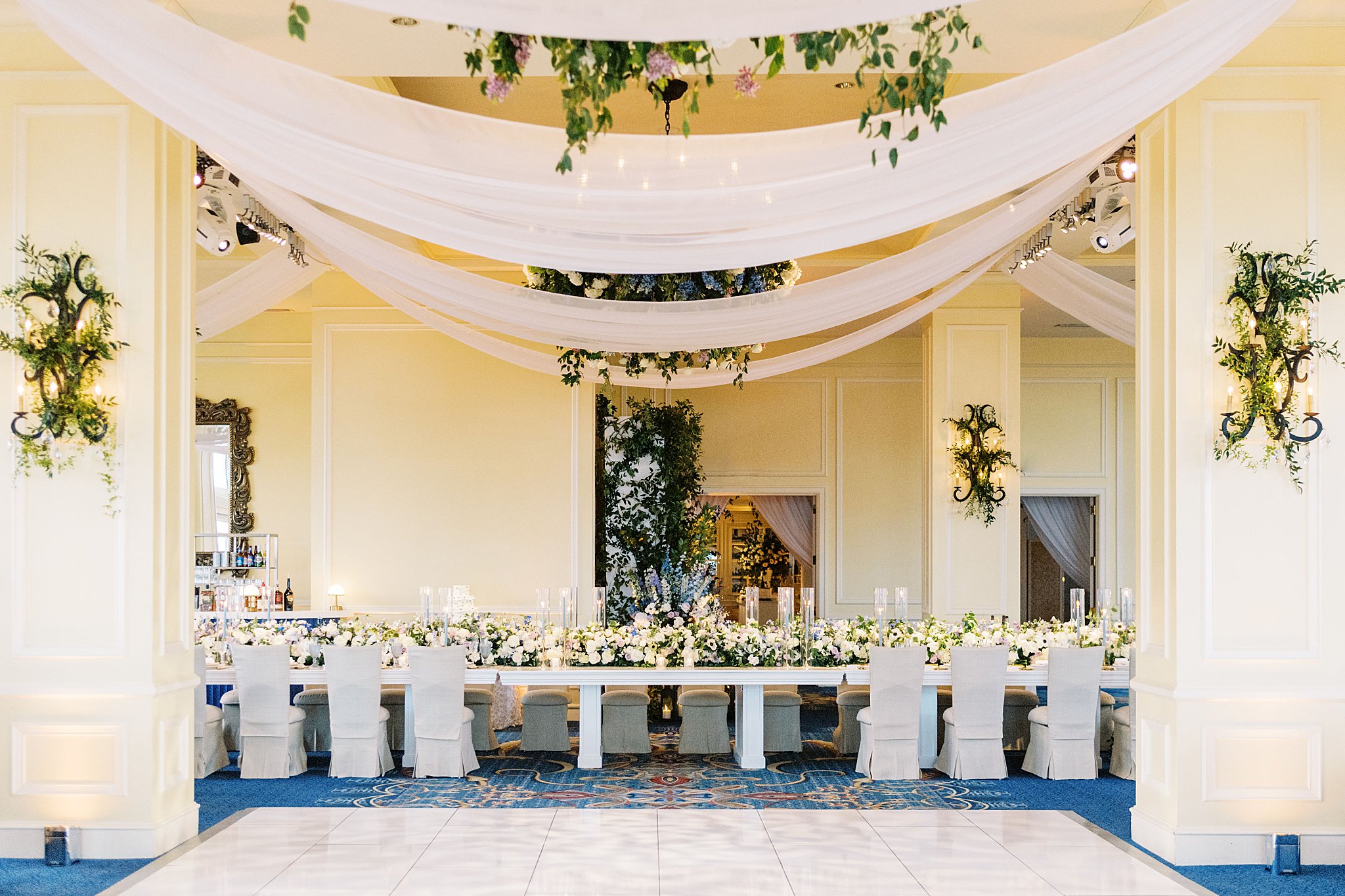 head table draped in florals at Boston Harbor Hotel