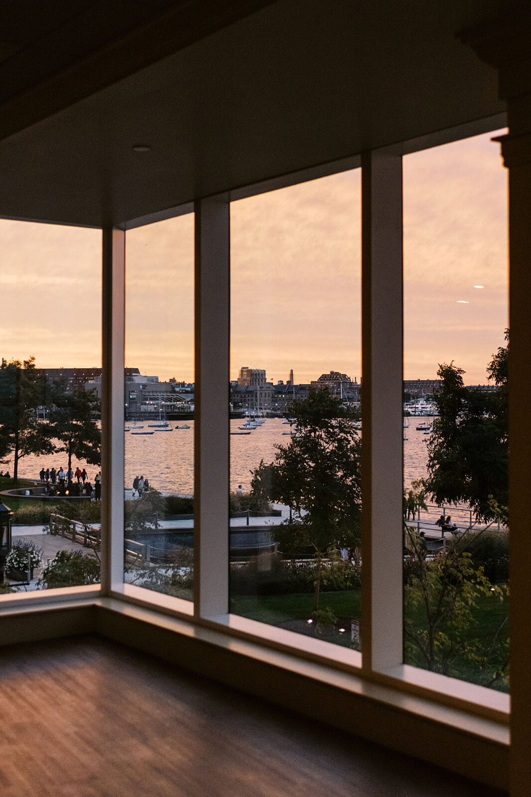 sun sets at reception before Boston Harbor Hotel wedding