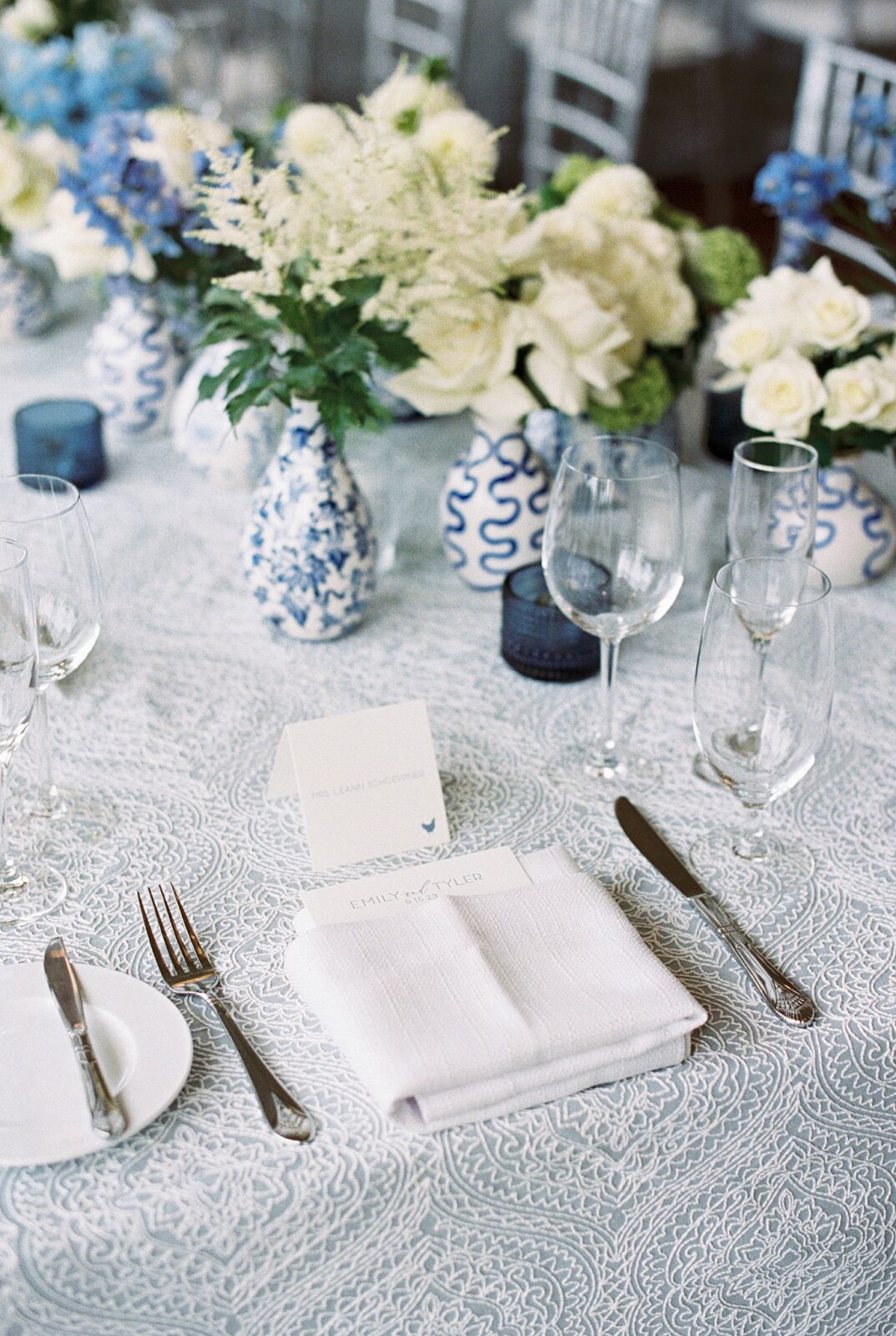 rehearsal place settings include blue and white before Boston Harbor Hotel ceremony