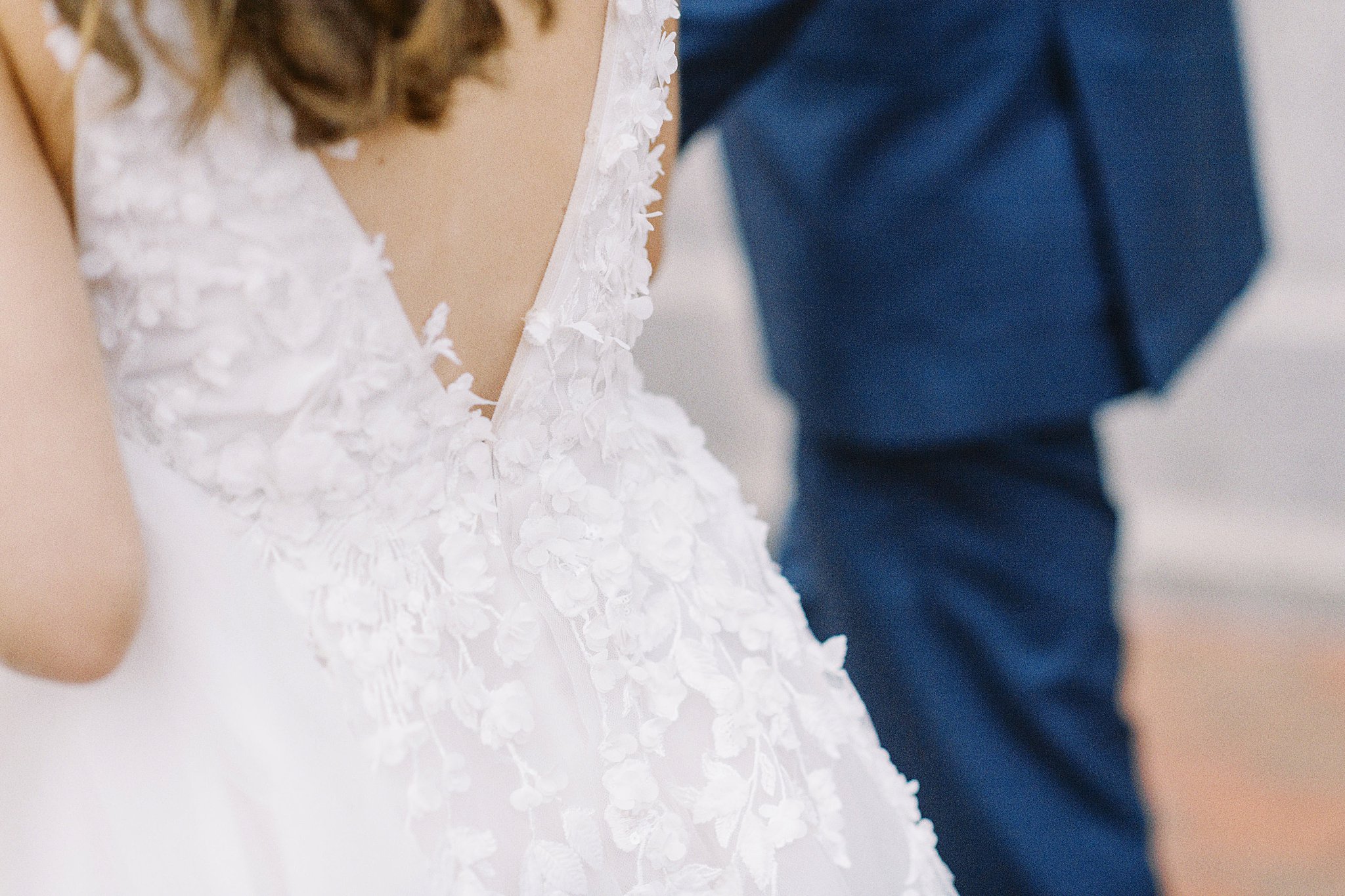 floral lace adorns wedding gown at Boston Harbor Hotel