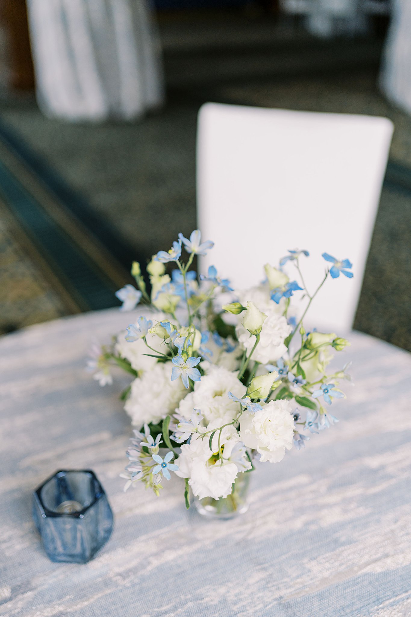 delicate white flowers sit on reception tables at Boston Harbor Hotel