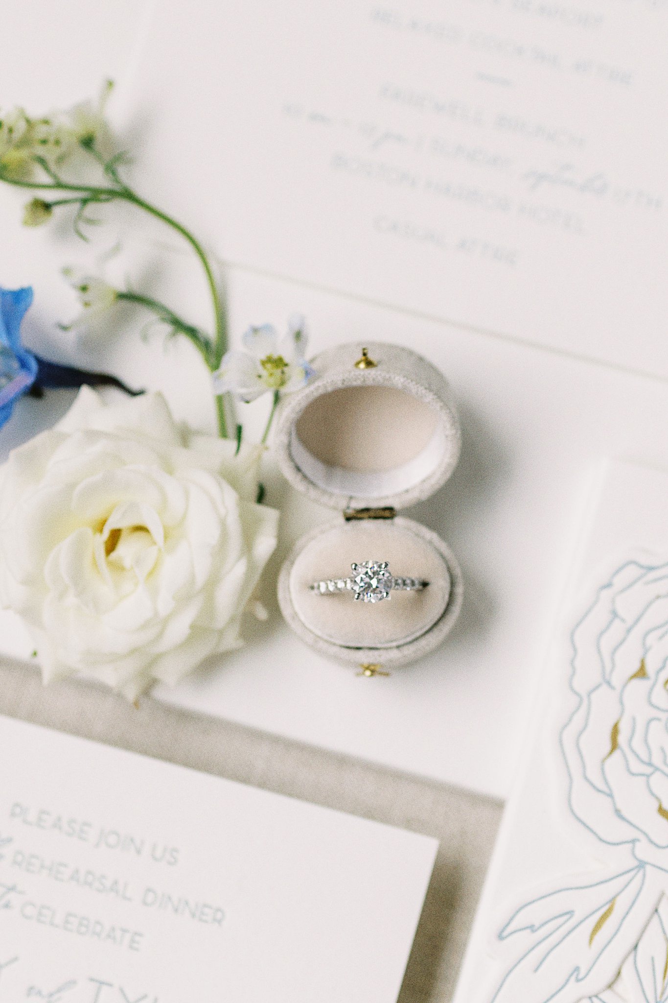 wedding ring sits with flat lay at Boston Harbor Hotel