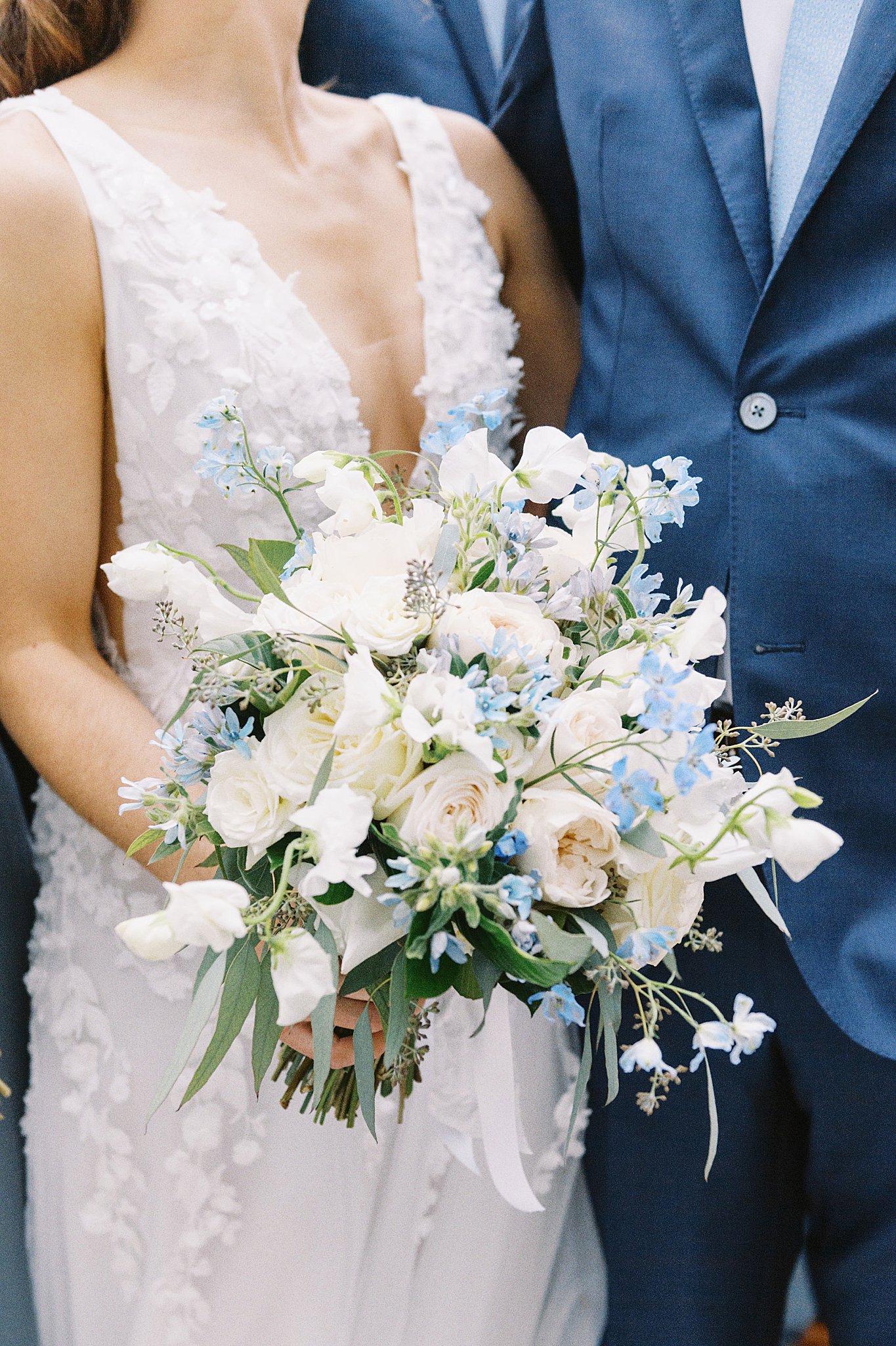 bridal bouquet full of white and blue florals by Boston wedding photographer