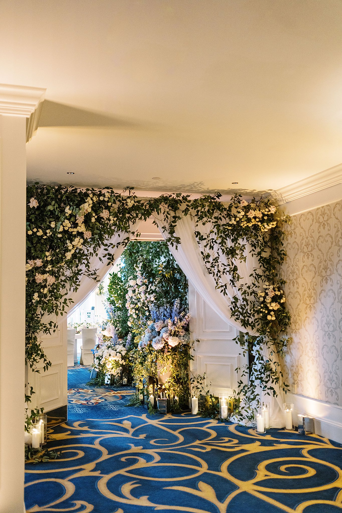 drapery and florals welcome guests to ballroom at Boston Harbor Hotel