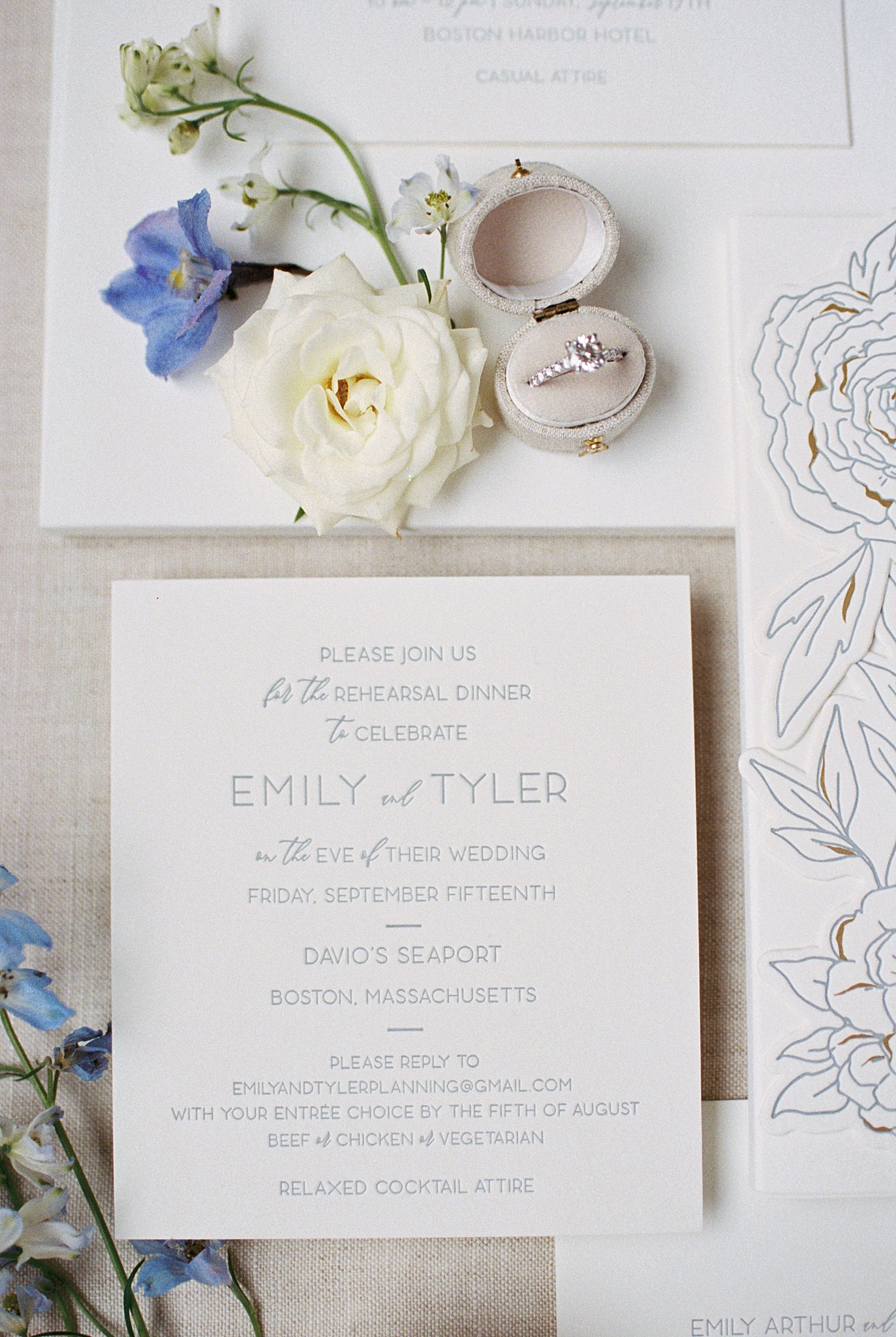 invitation suite laid out with wedding ring by Lynne Reznick Photography 