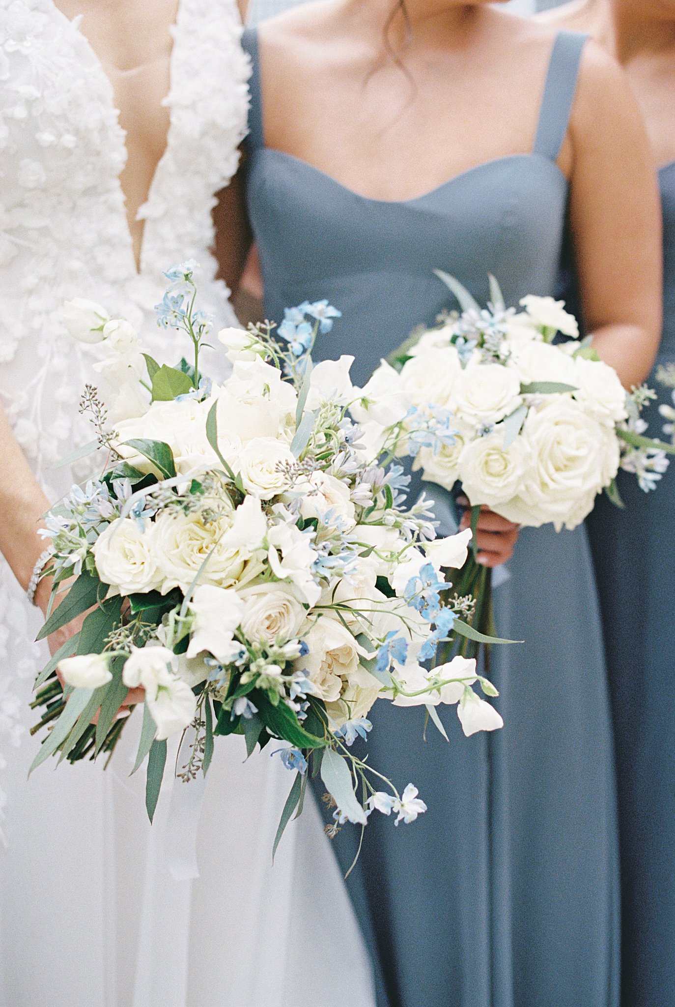 bride and bridesmaids hold bouquets by Lynne Reznick Photography 