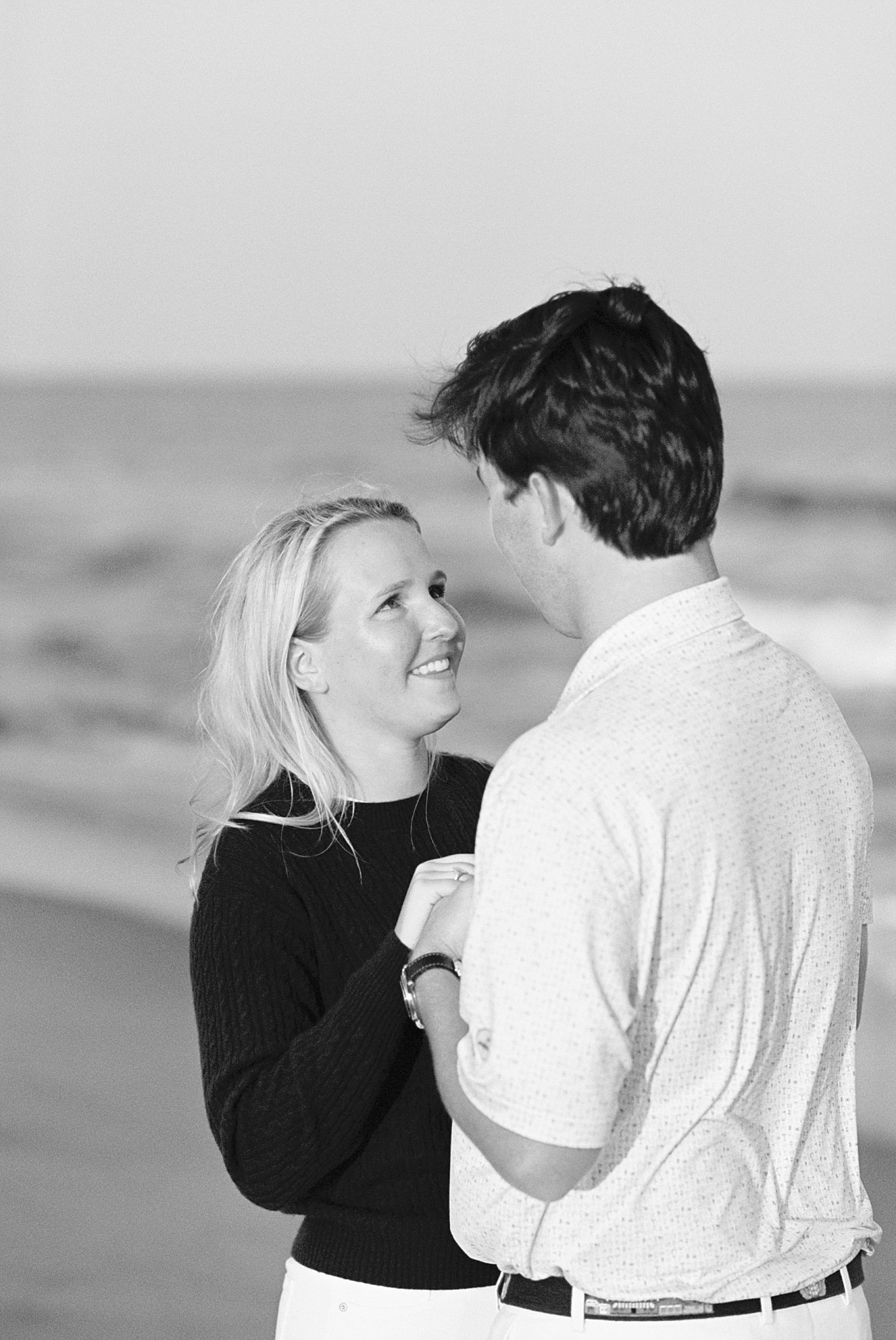 woman smiles up at her fiancé by Lynne Reznick photography 