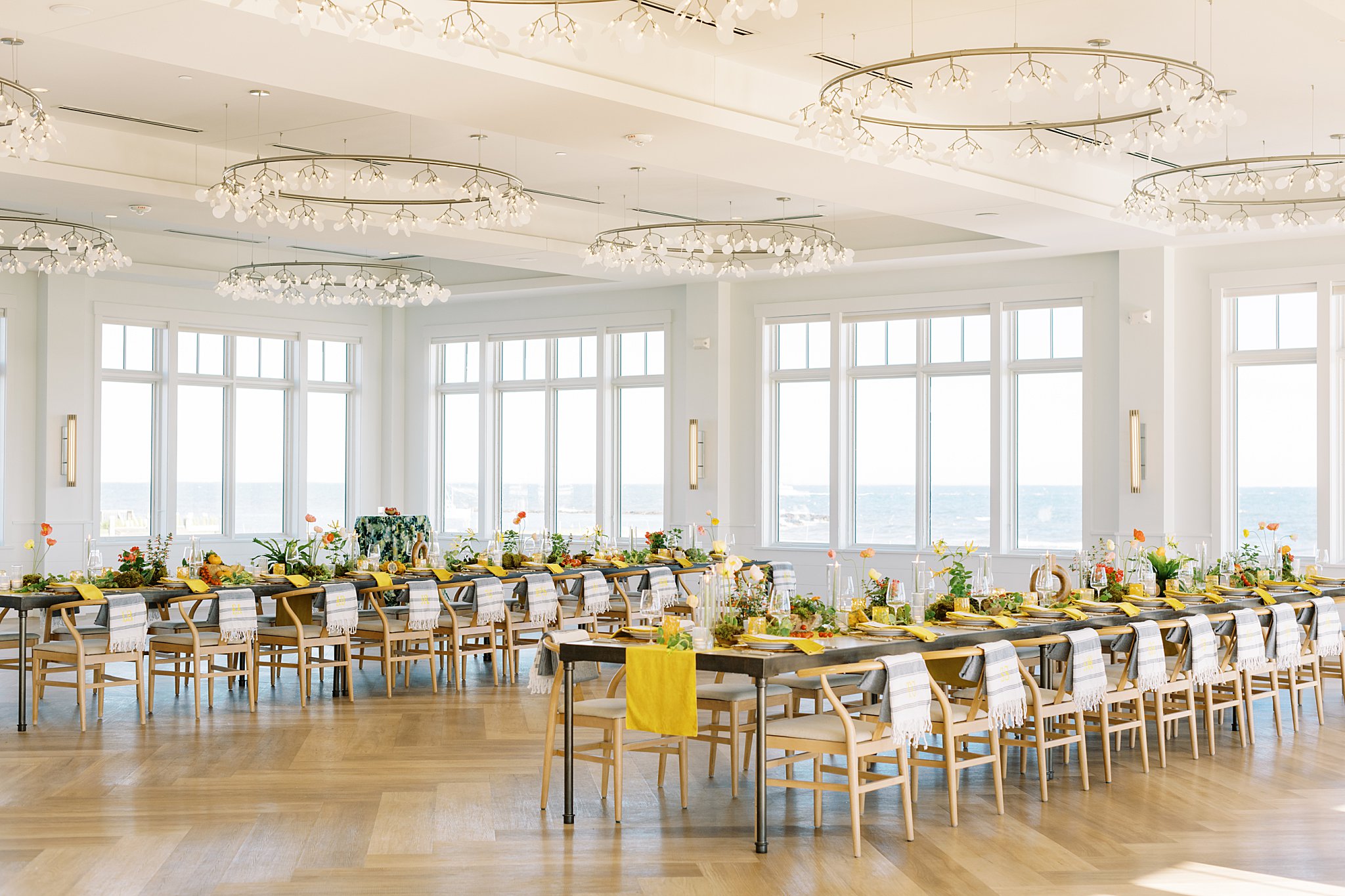 Cape Cod wedding photographer captures tables decorated with bright linens and florals