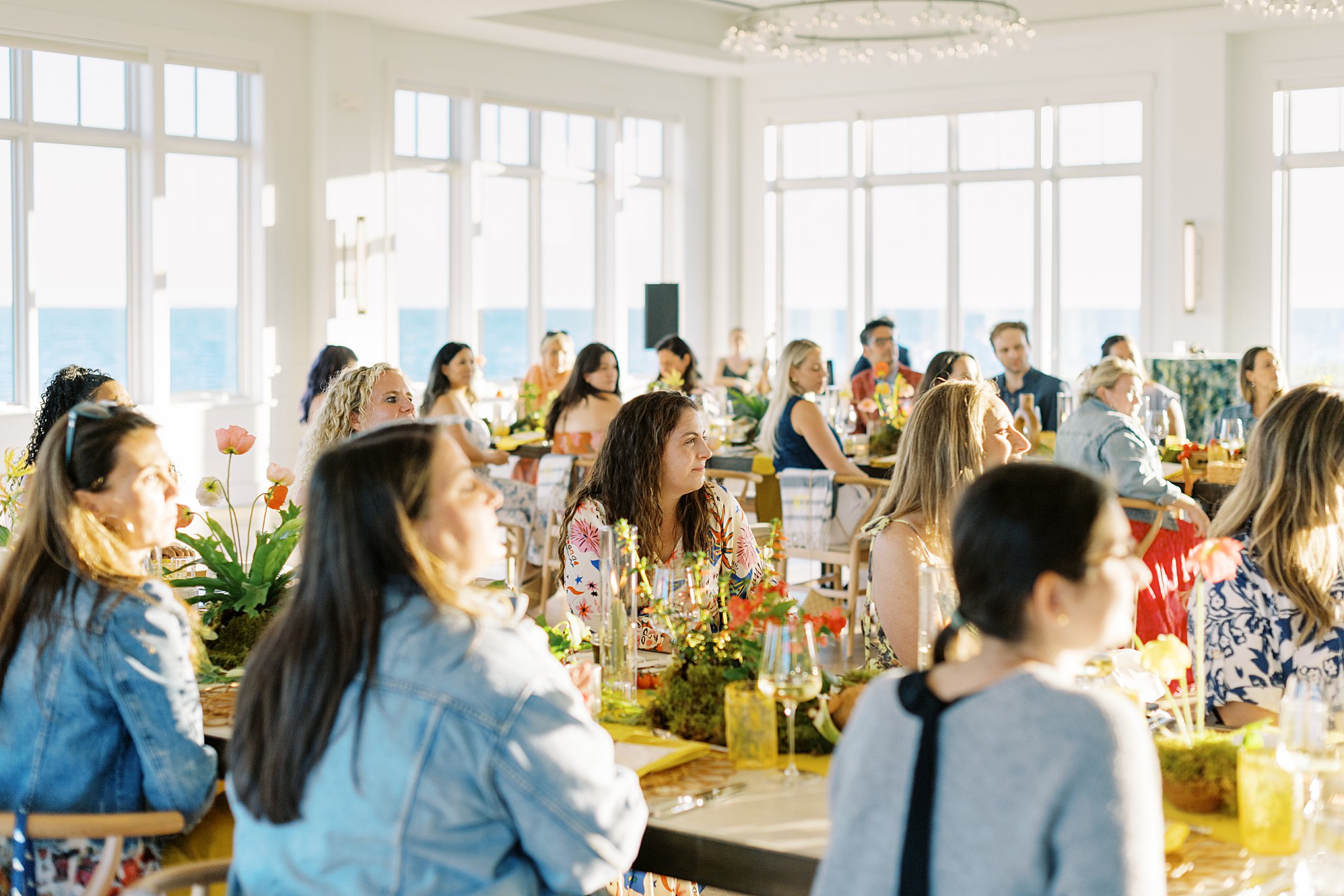 guests listen to host share message by Cape Cod wedding photographer