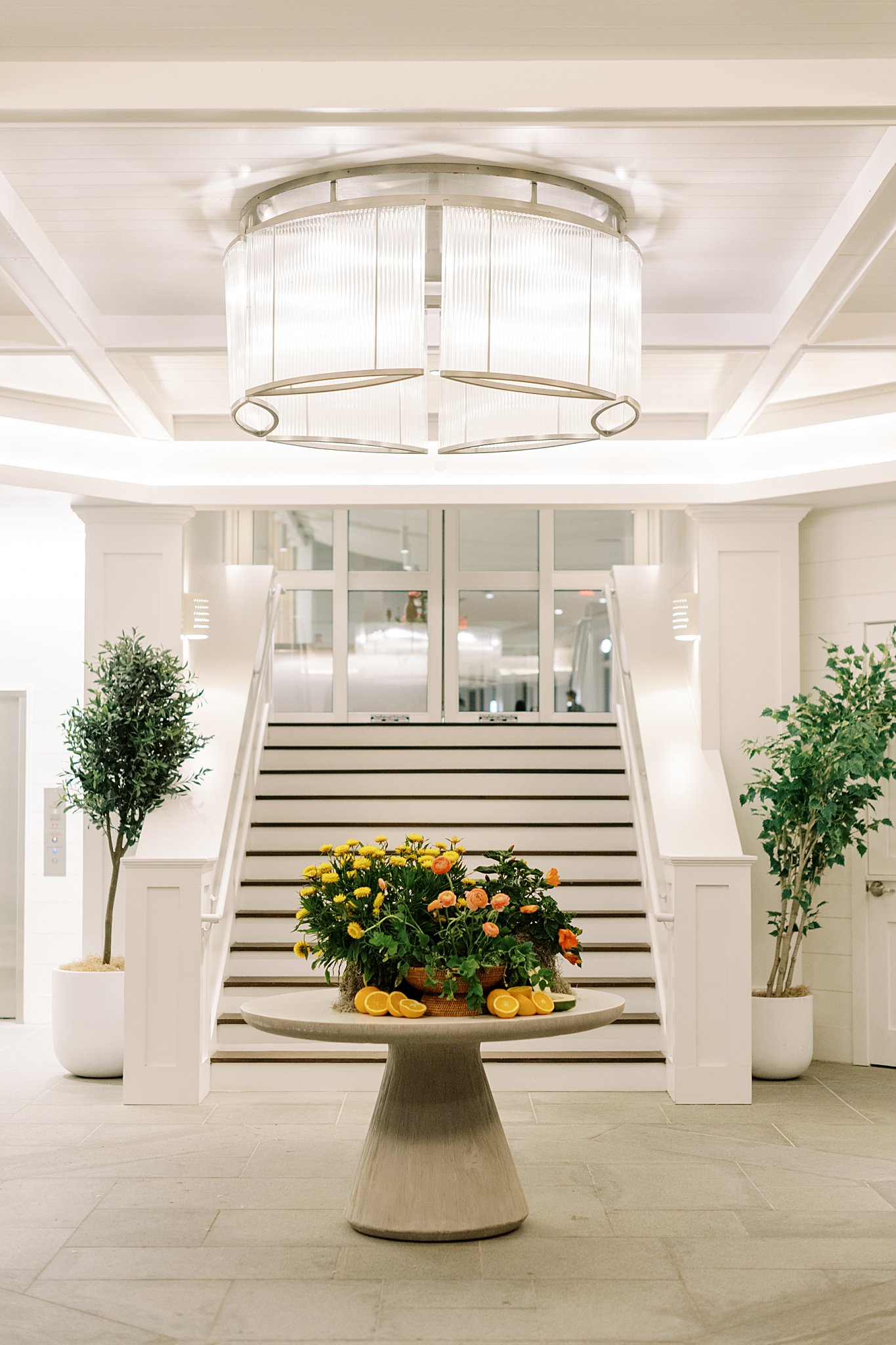 table decorated with florals and citrus by Cape Cod wedding photographer