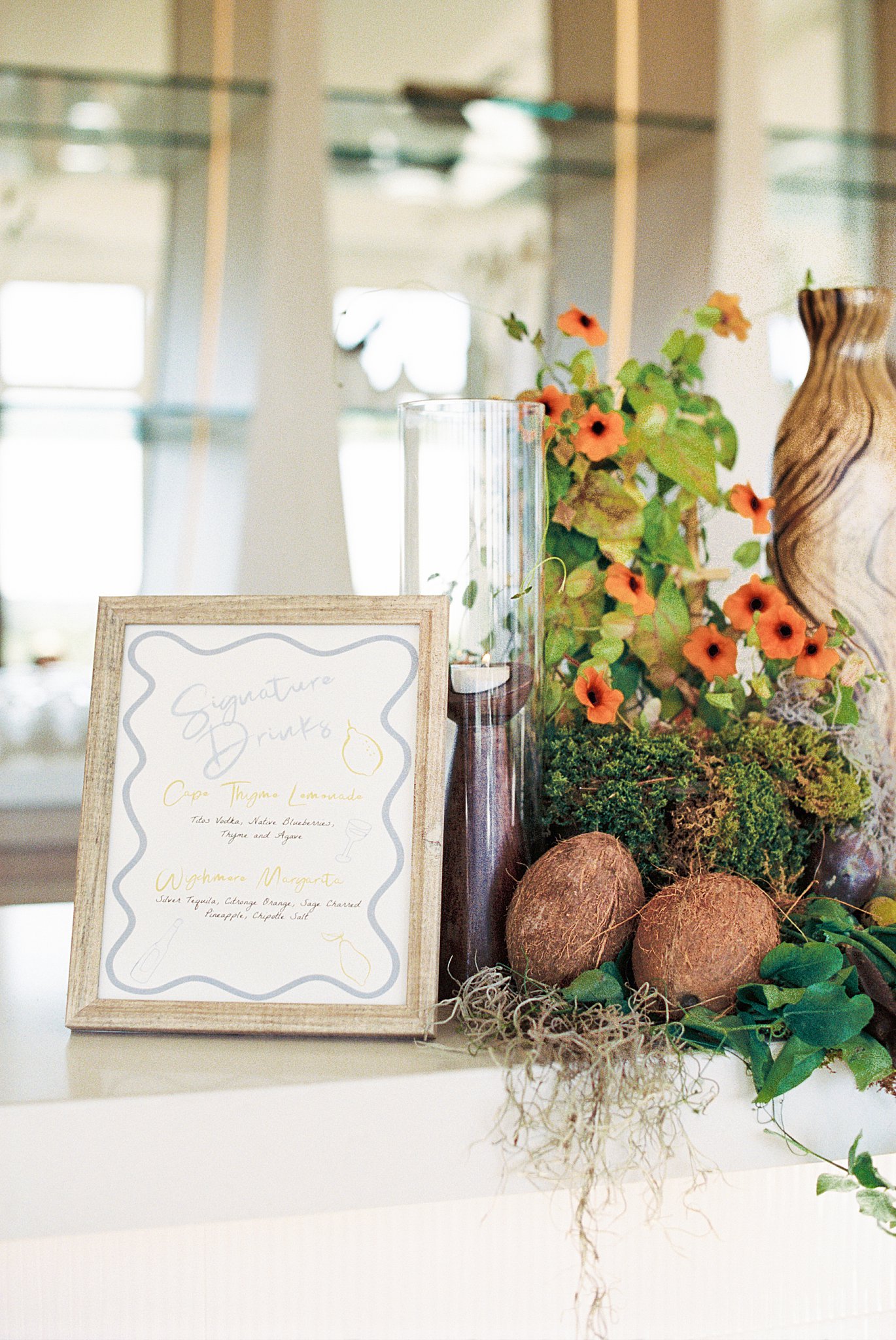 signature drink menu sits atop bar by Cape Cod wedding photographer