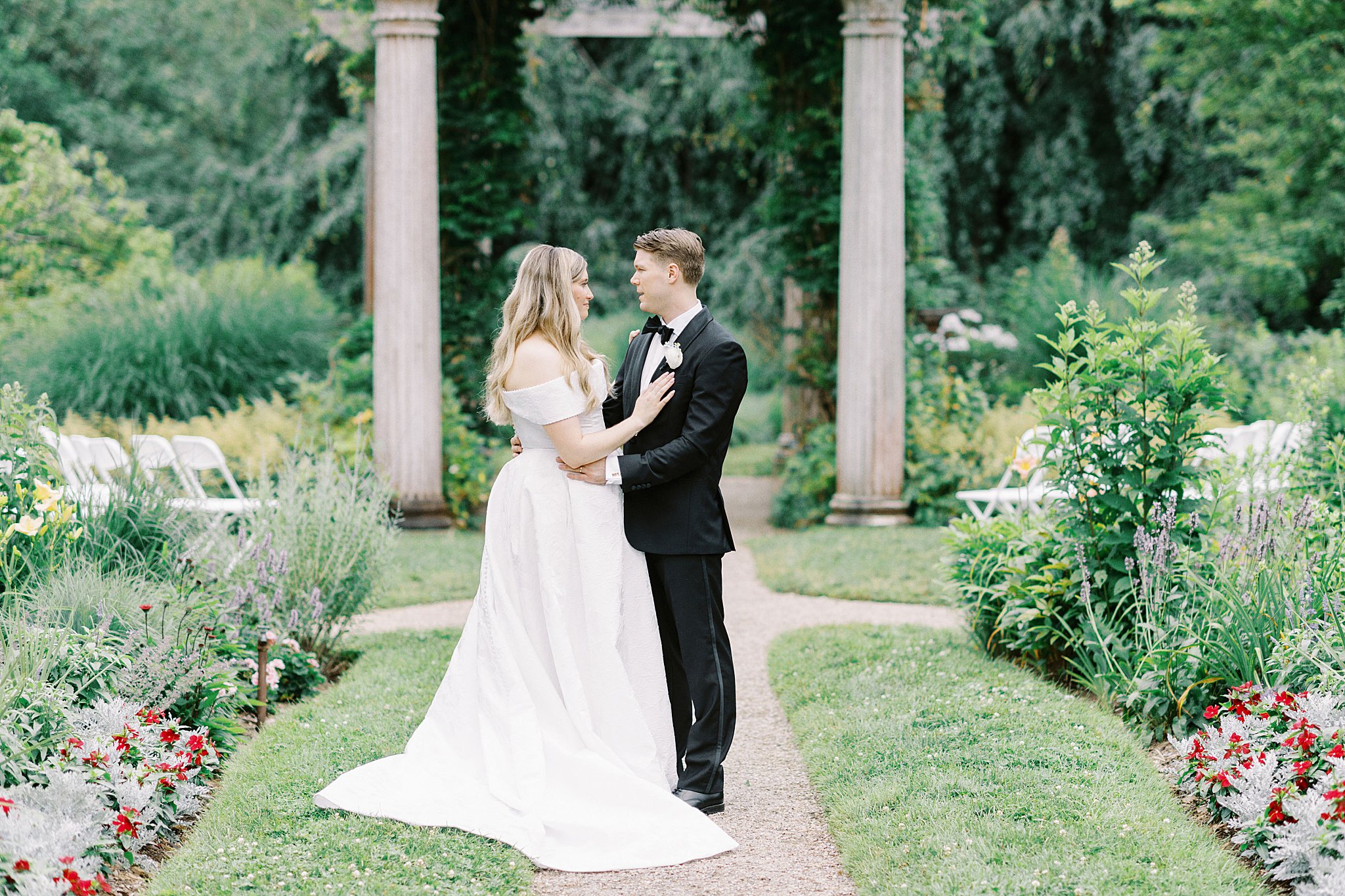 woman rests hand on man's chest near the altar by Lynne Reznick Photography