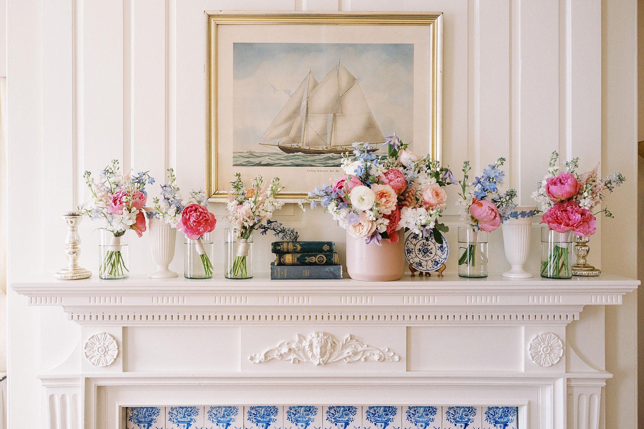 mantle holding colorful bouquets by Lynne Reznick Photography