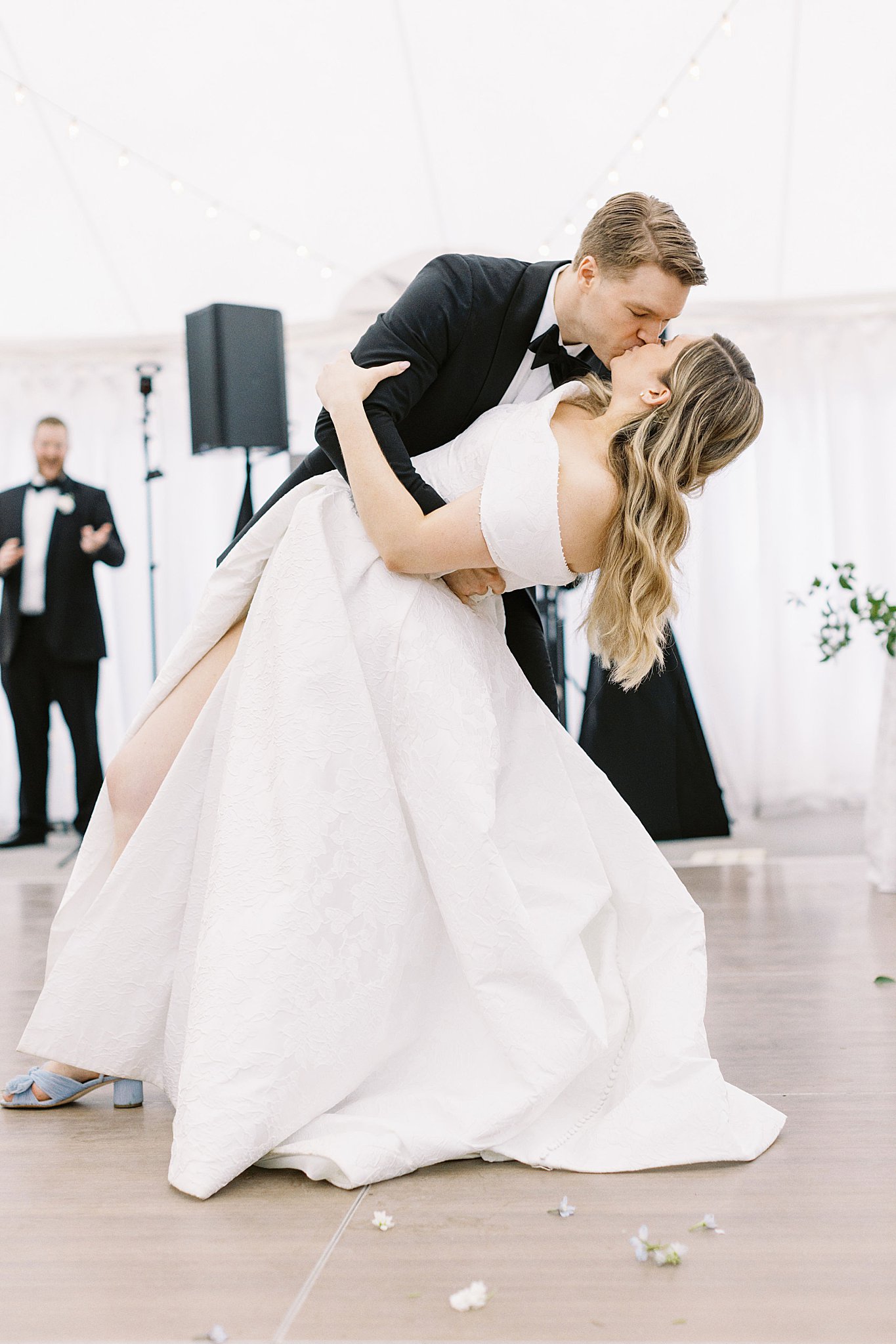 man dips woman and kisses her by Boston wedding photographer