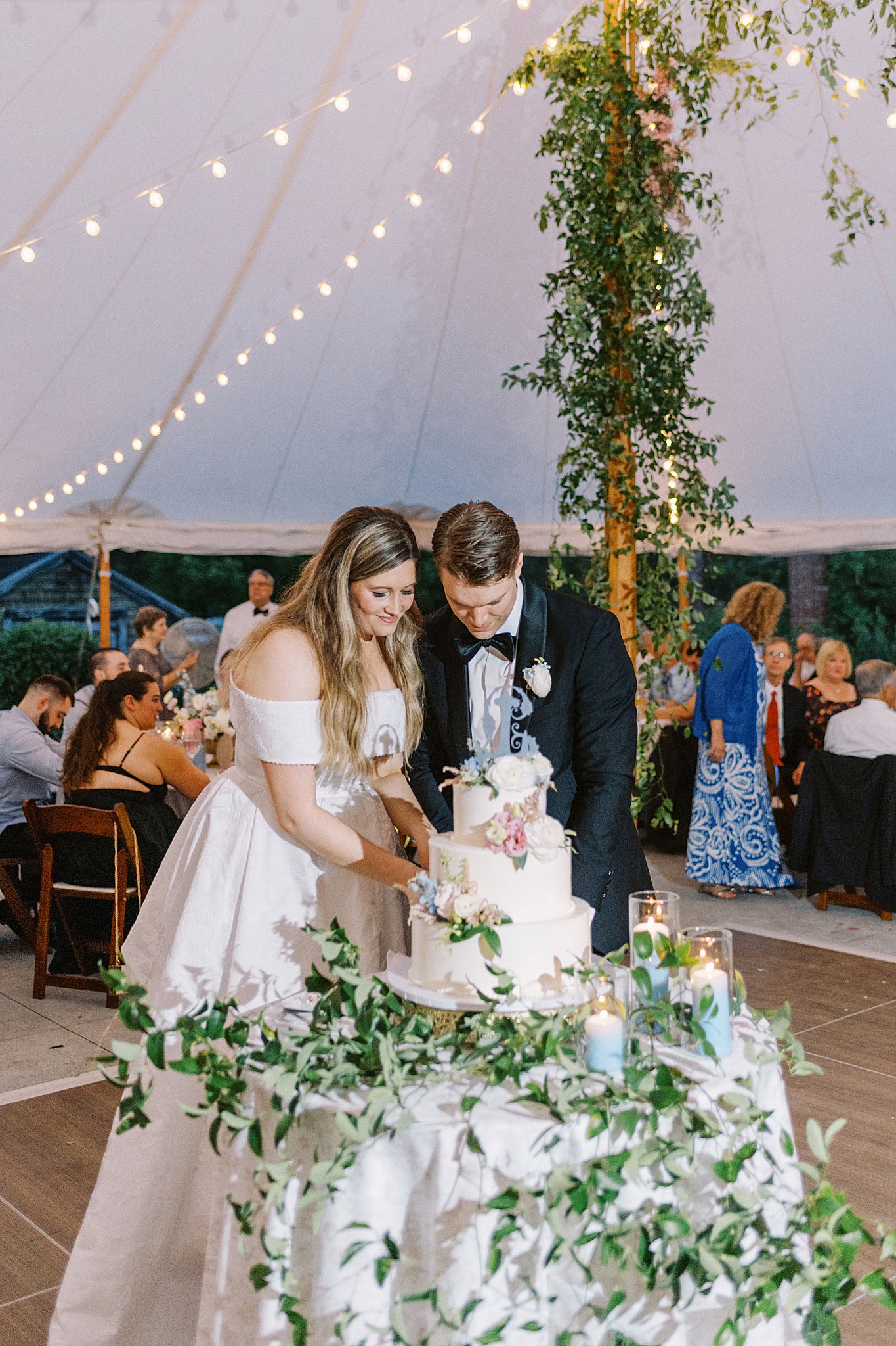 bride and groom cut wedding cake at Glen Magna Farms