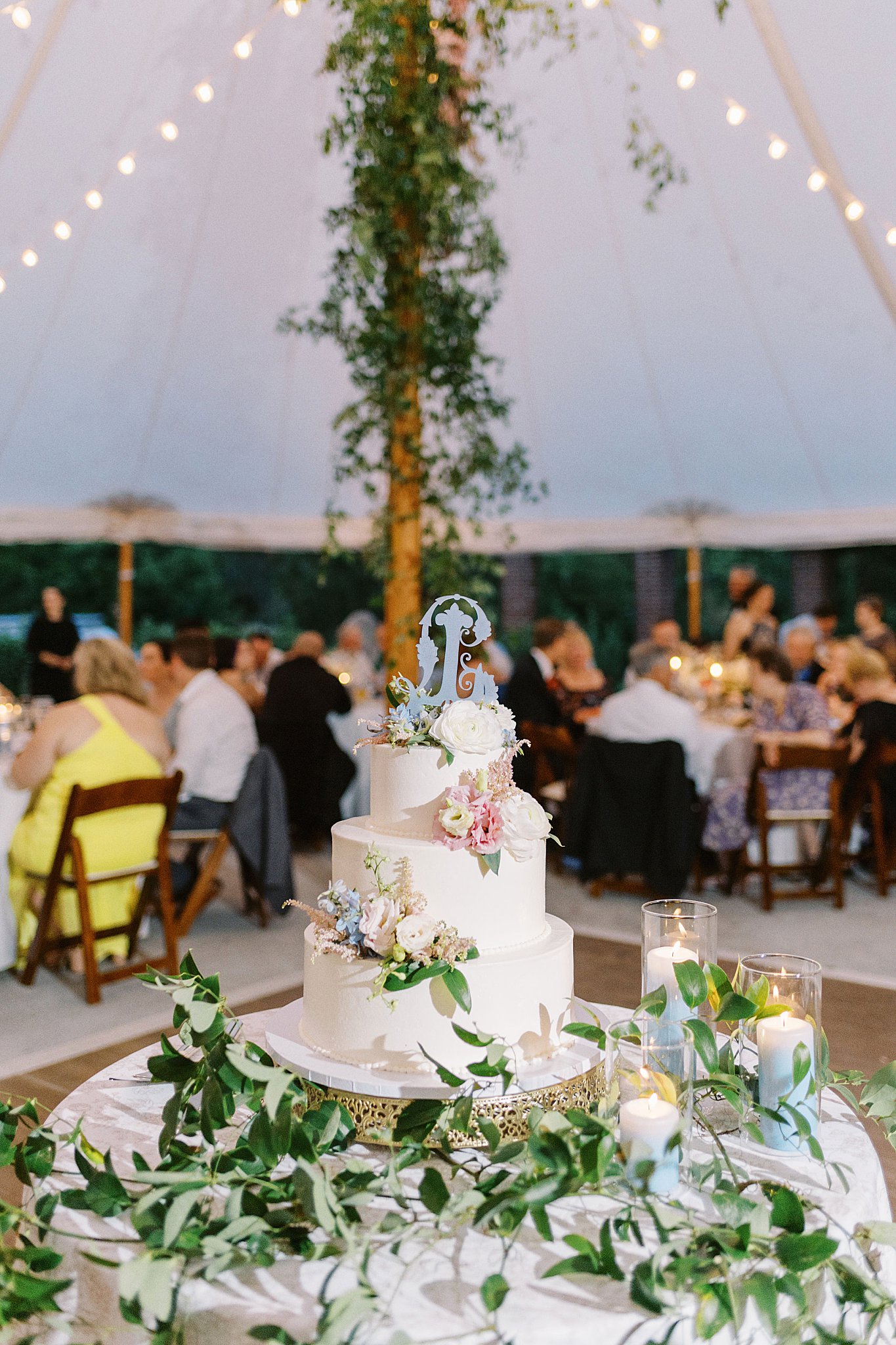 cake decorated with florals and monogram by Boston wedding photographer