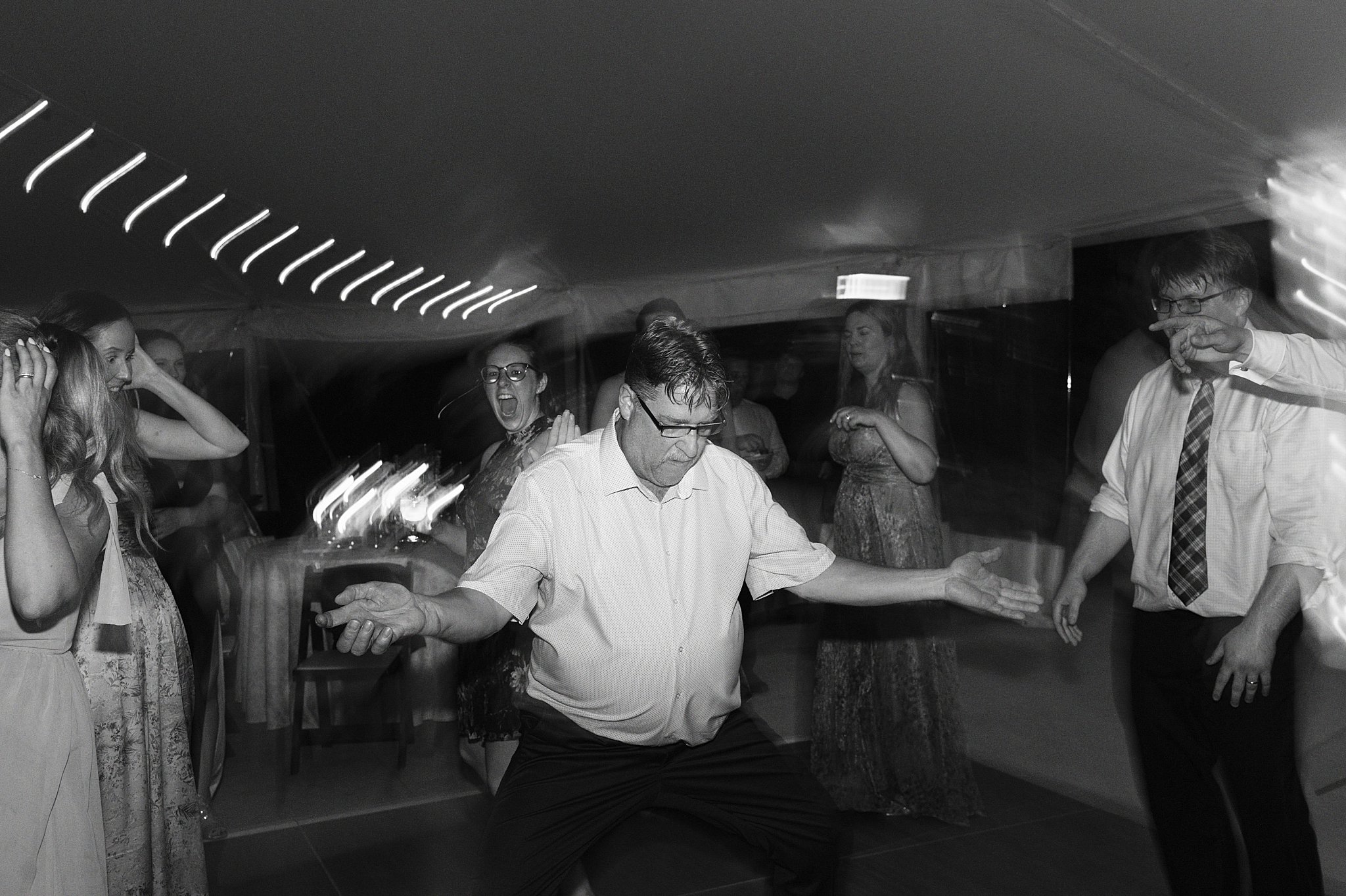 guests dance during reception at Glen Magna Farms