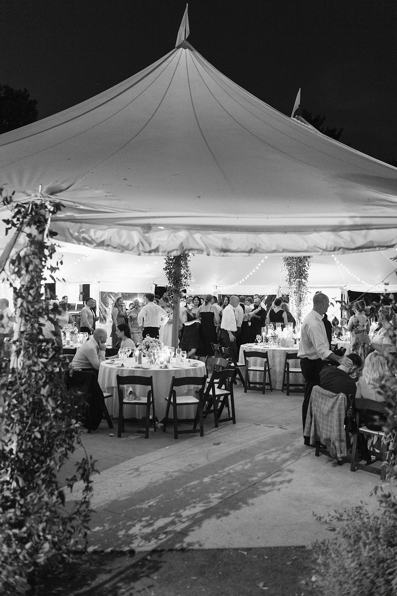 guests enjoy reception and dancing at night by Lynne Reznick Photography