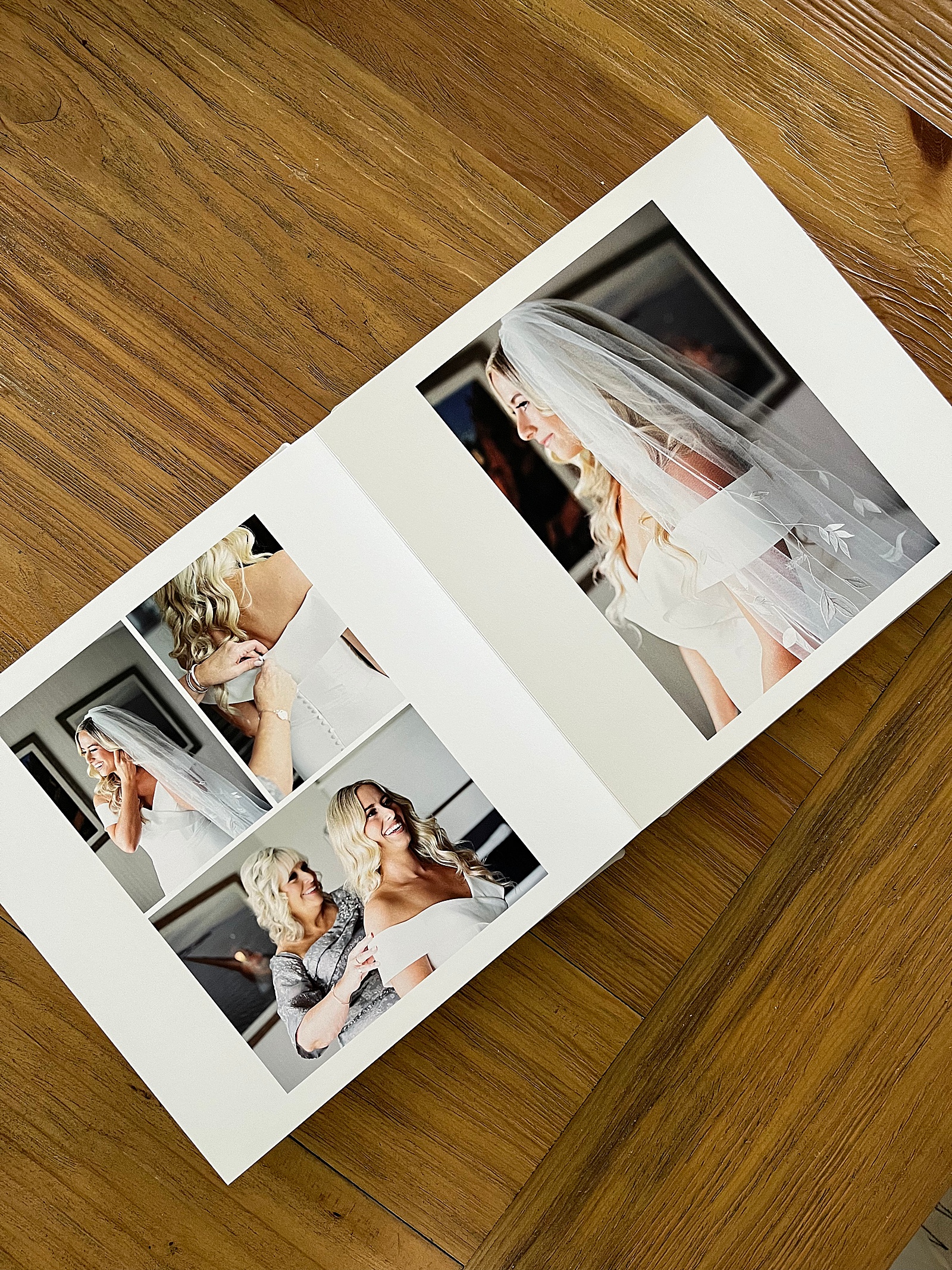 a flat lay photo book on wooden table by Lynne Reznick Photography