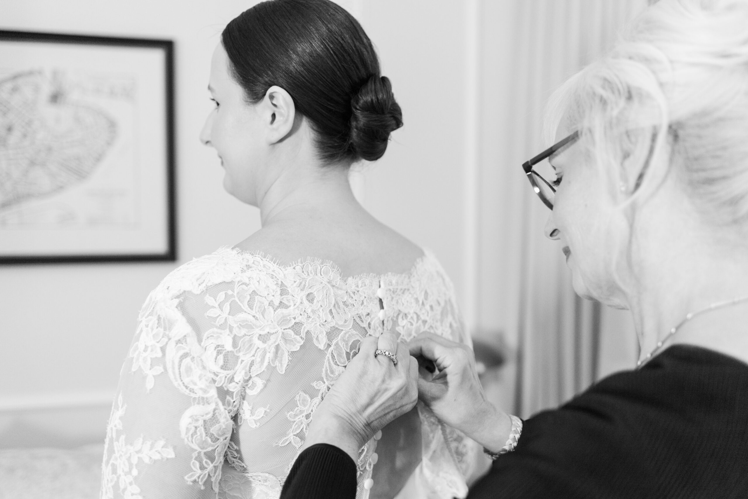 black and white image of mom button lace jacket for daughter who is a bride