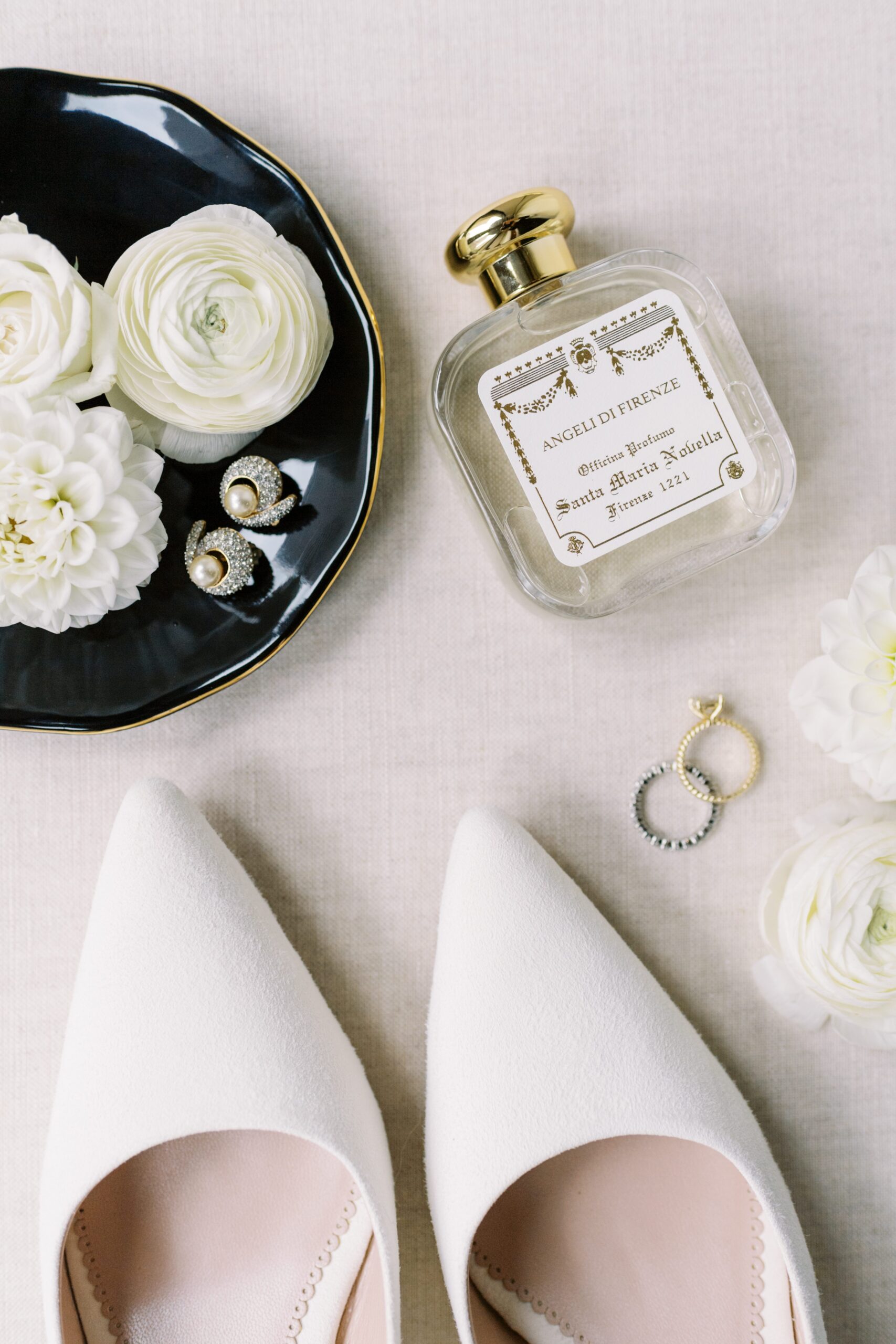 bridal details laid out including shoes, earrings, and perfume from Florence for a Boston wedding 