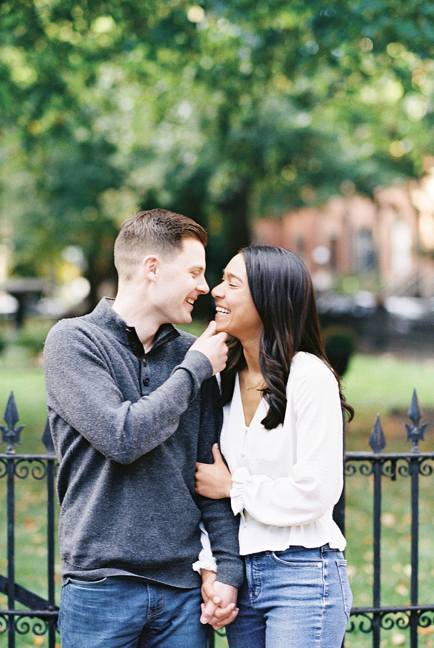 man pulls woman in close for kiss by Boston Wedding Photographer