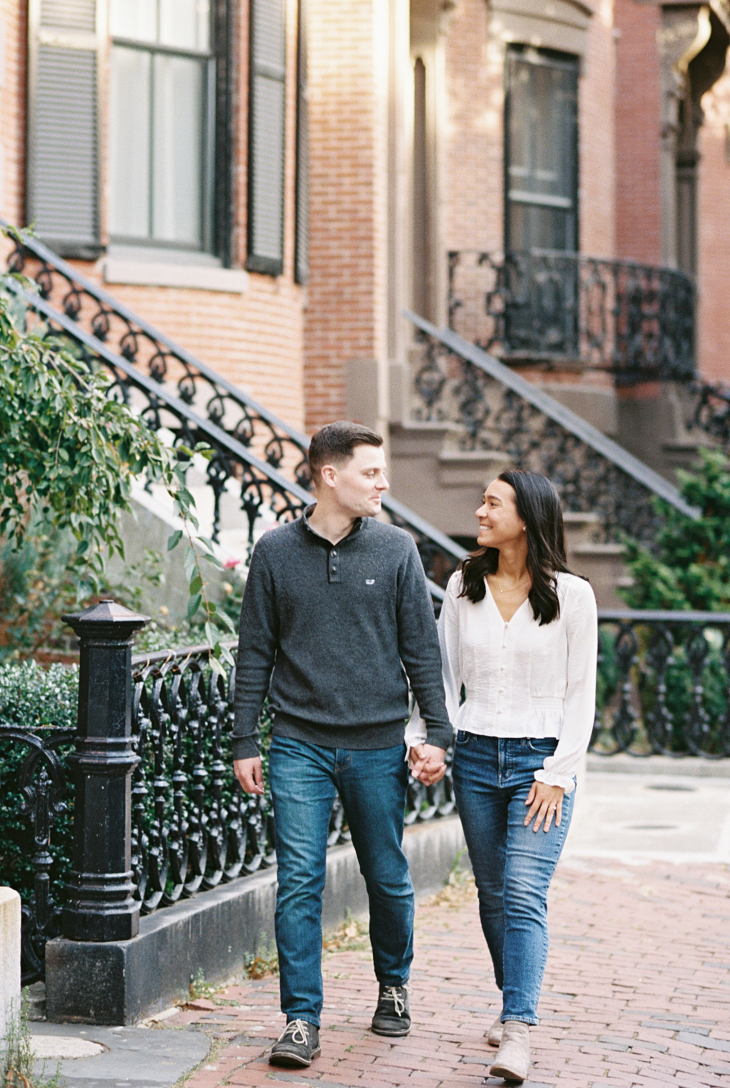 best friends who are engaged walk together by Lynne Reznick Photography