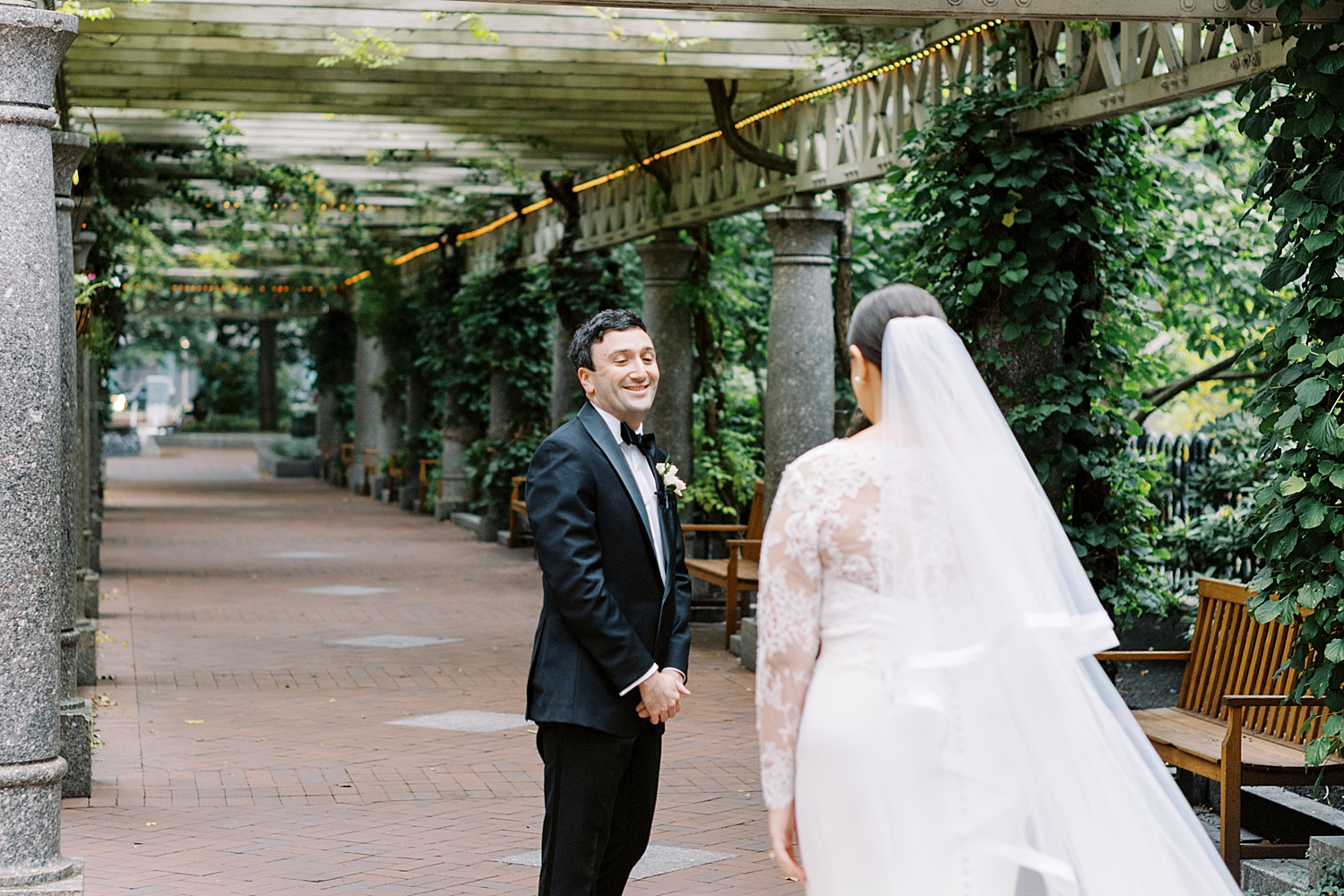 bride approaches groom for first look at Langham Hotel