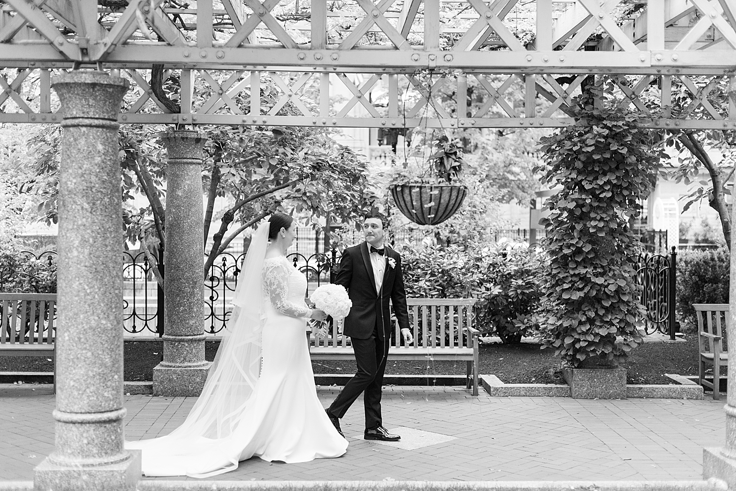 man and woman walk down garden pathway by Boston Wedding Photographer 