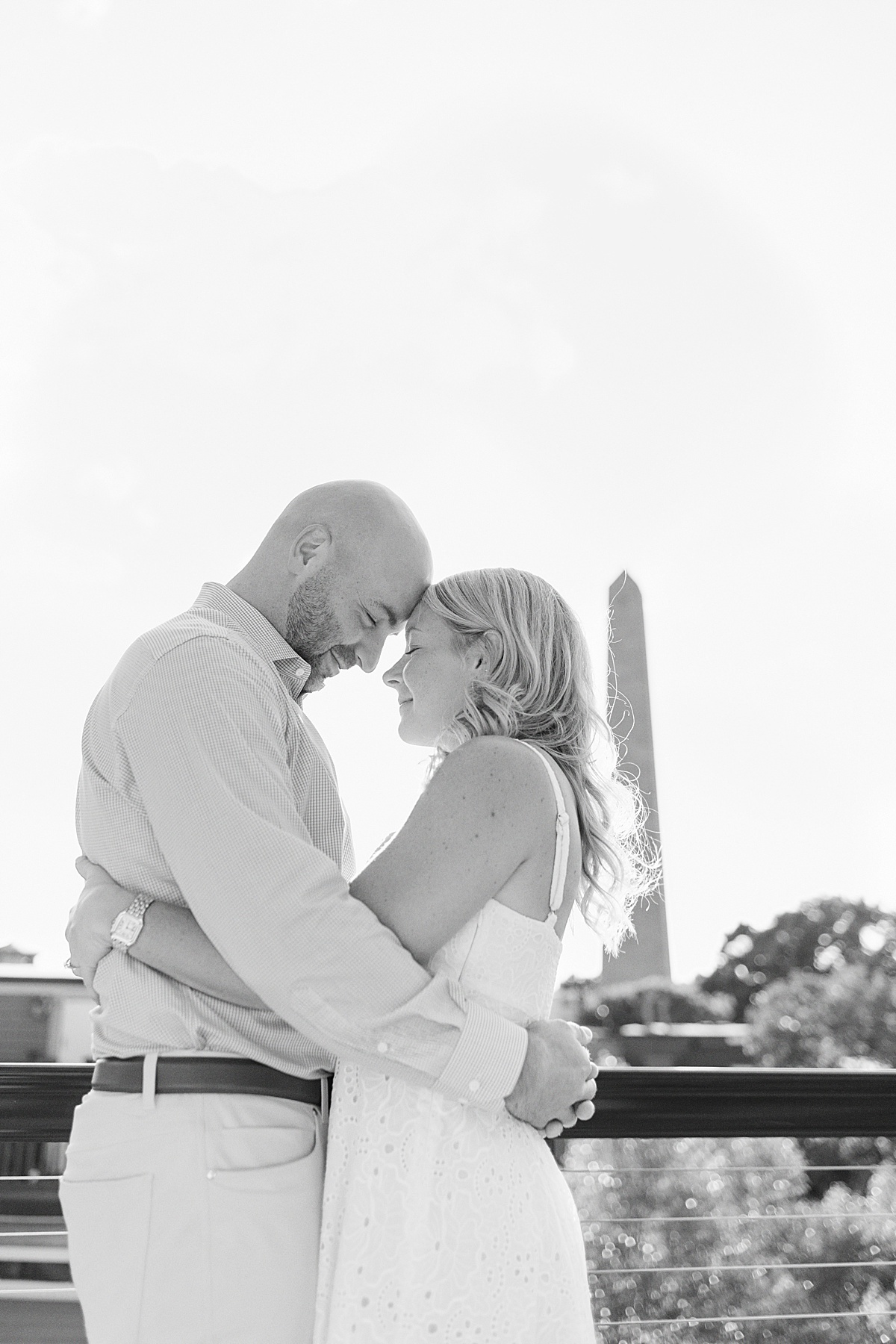 Man and woman cuddle in close together for Boston Wedding Photographer