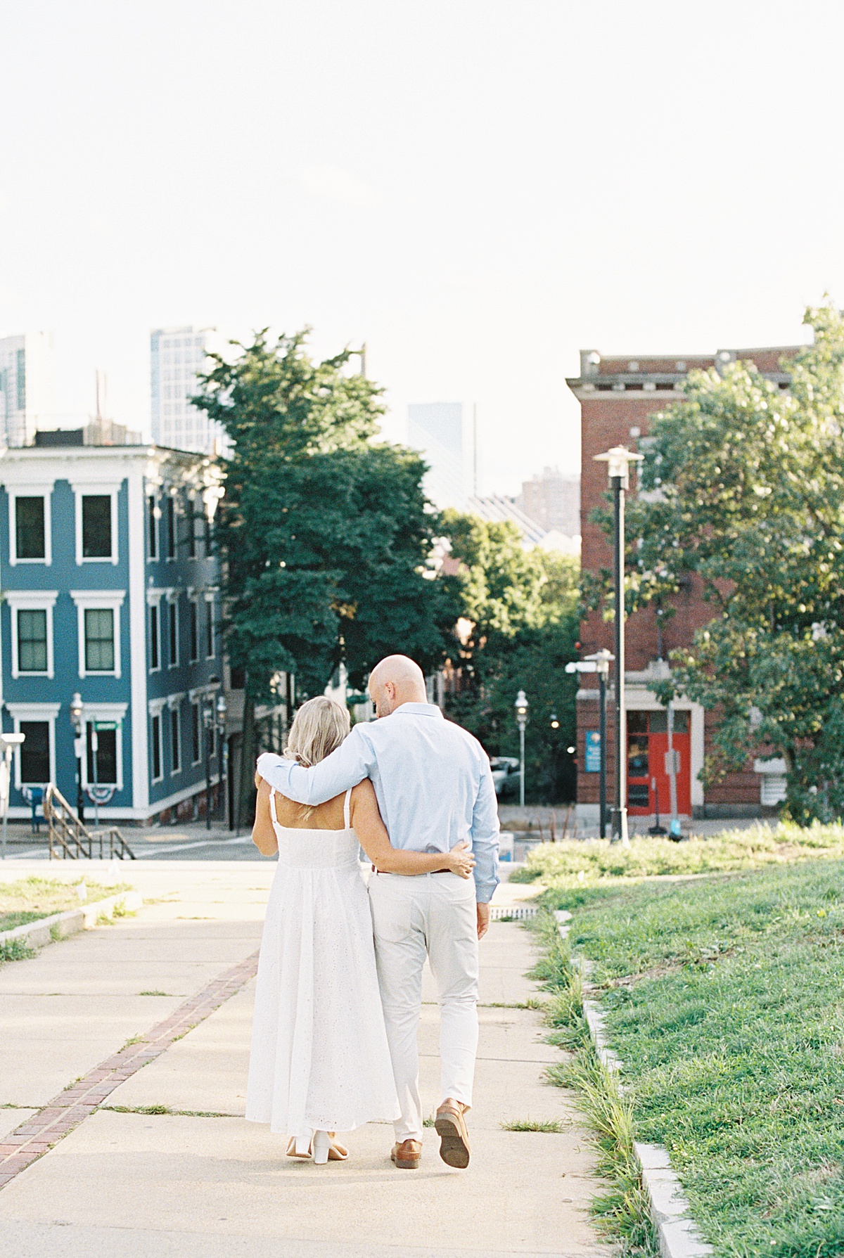 Couple walk together holding one another for Lynne Reznick Photography
