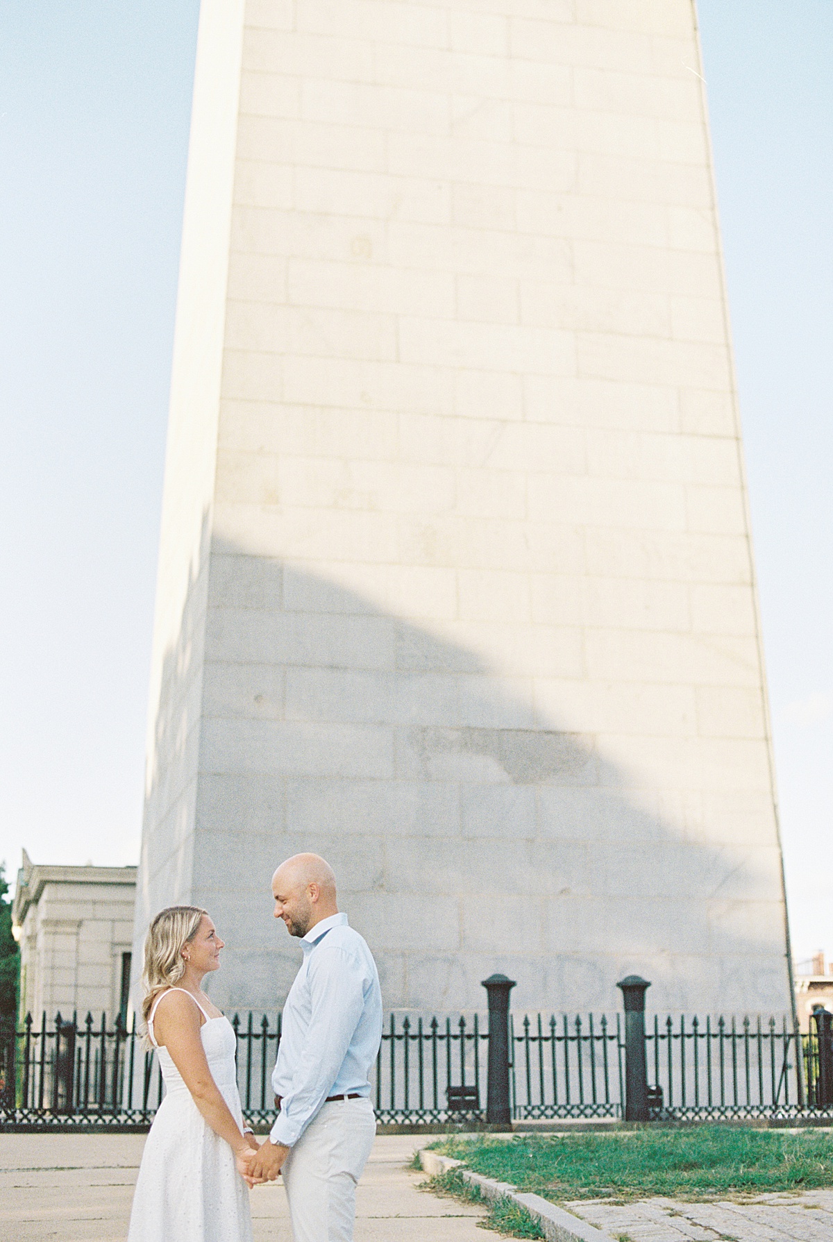 Man and woman hold hands facing each other for Boston Wedding Photographer