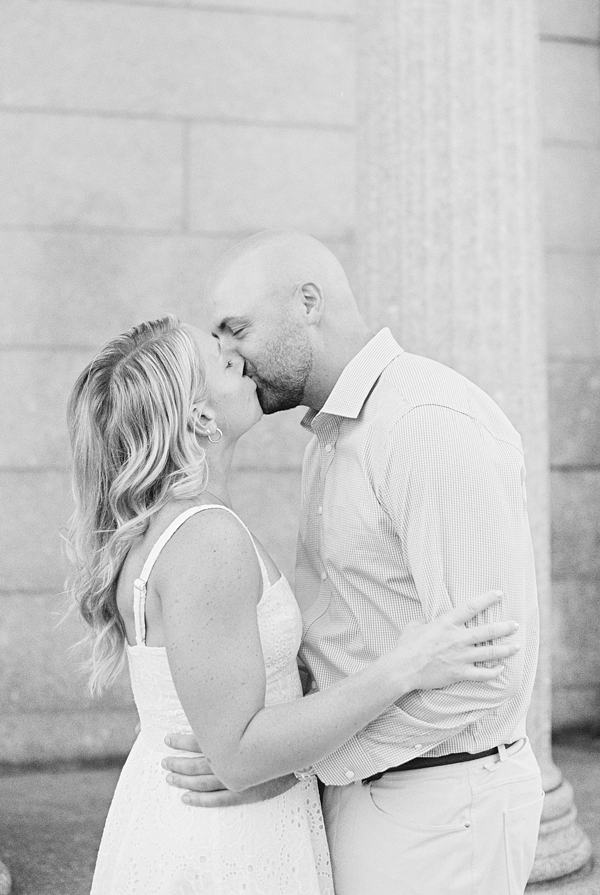 Engaged couple share a kiss for Lynne Reznick Photography
