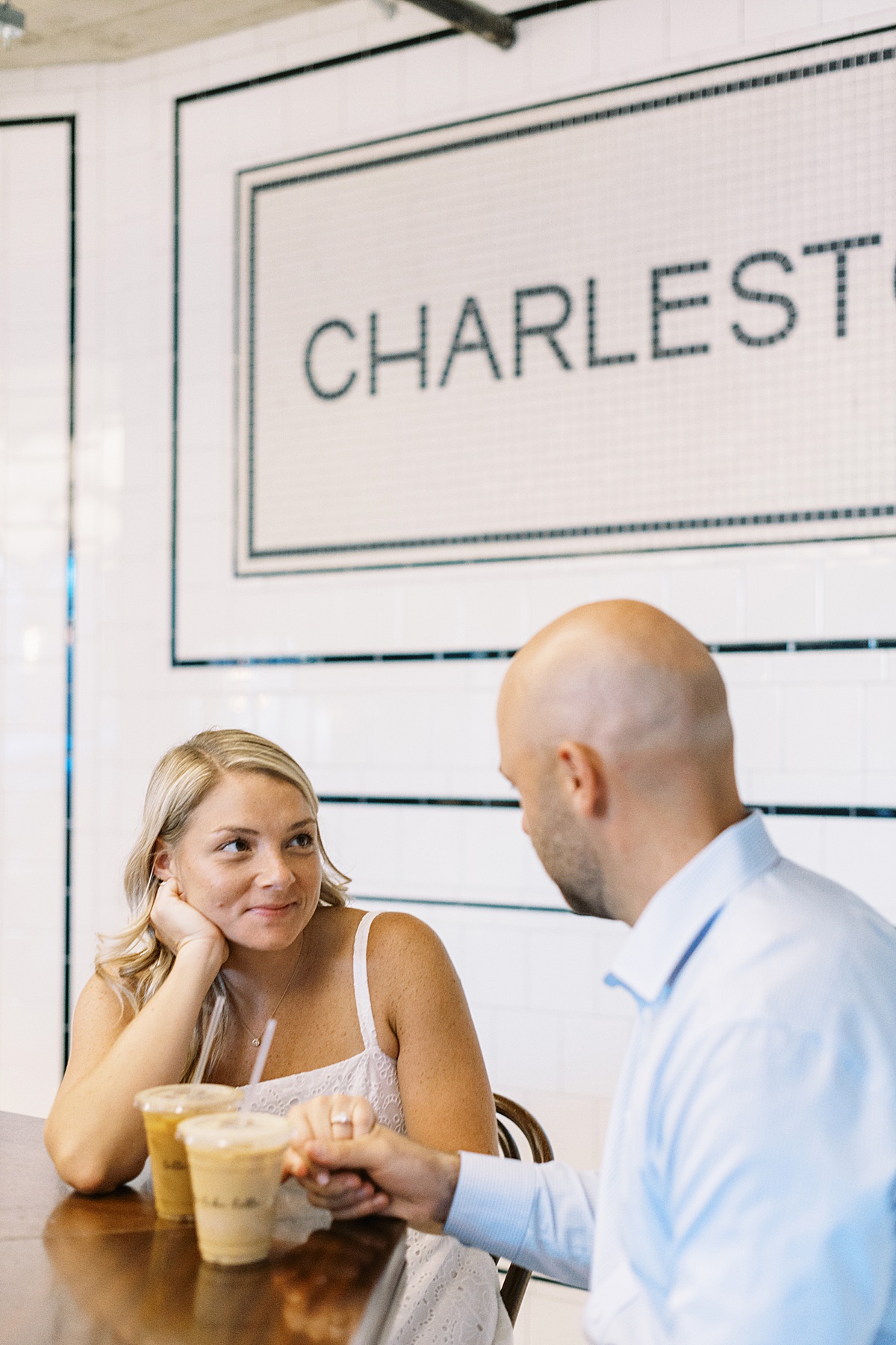 Woman smiles at man during their Charlestown Engagement Session 