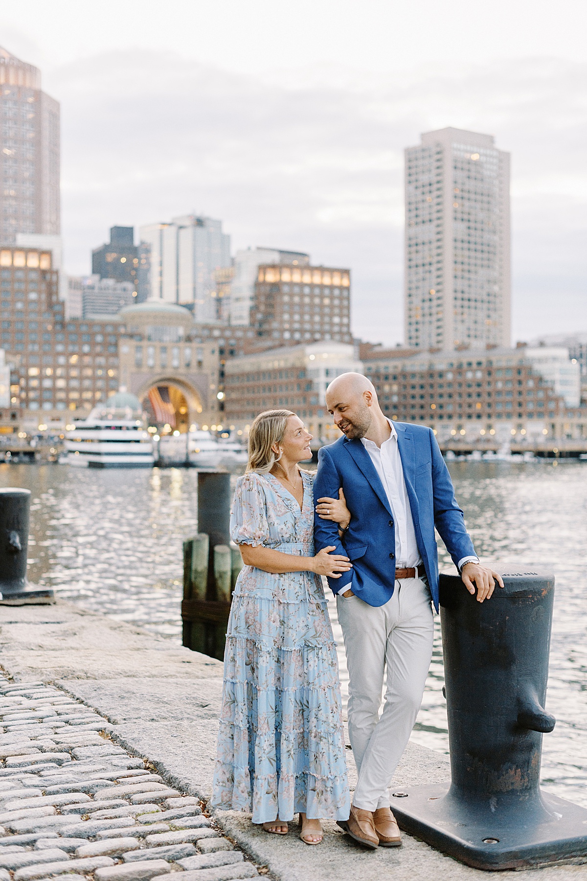 Couple walk together and hold each other close during their Charlestown Engagement Session 