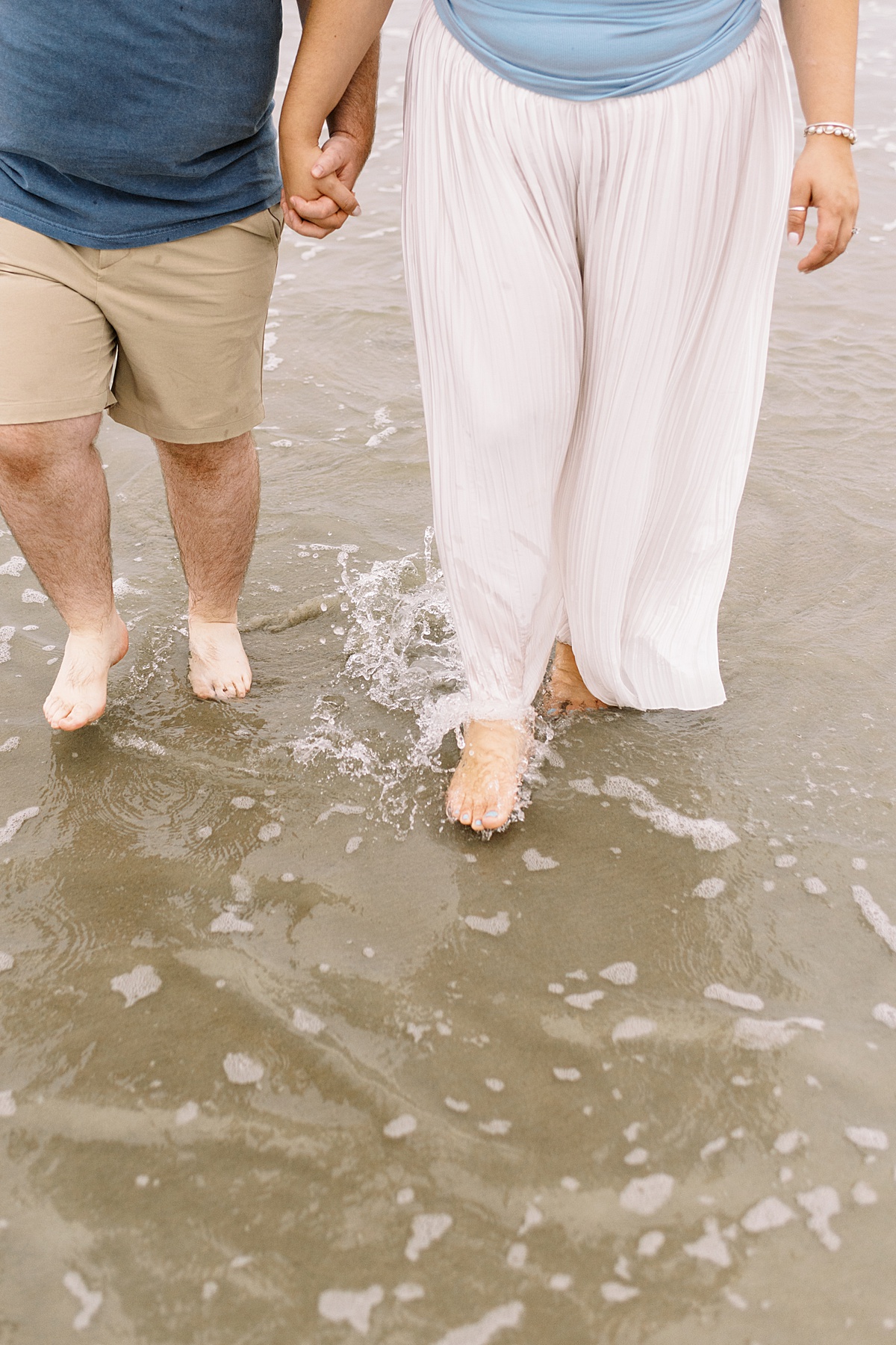 Couple walk in the water together for Coastal Maine Wedding Photographer