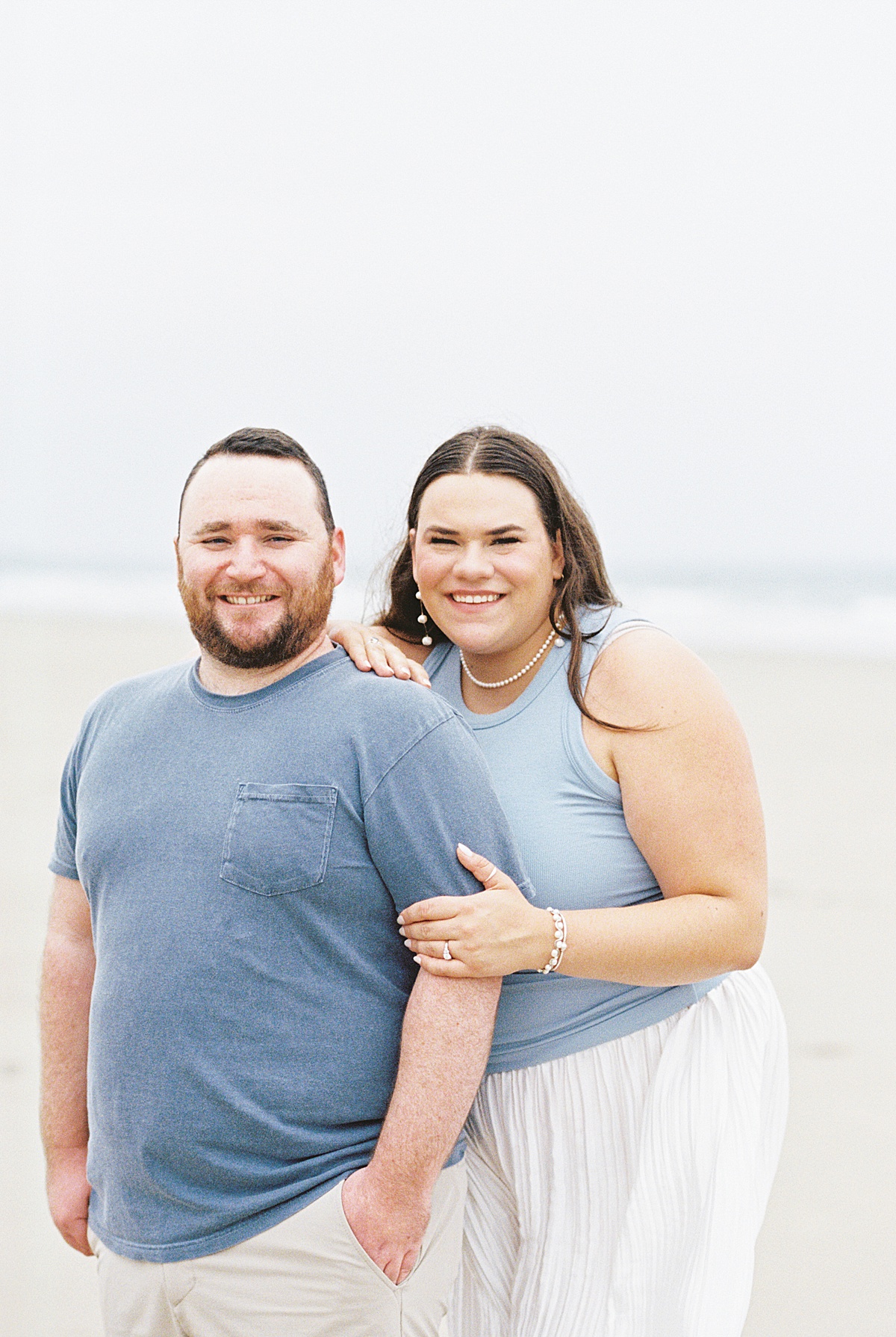 Engaged couple stand together for Coastal Maine Wedding Photographer