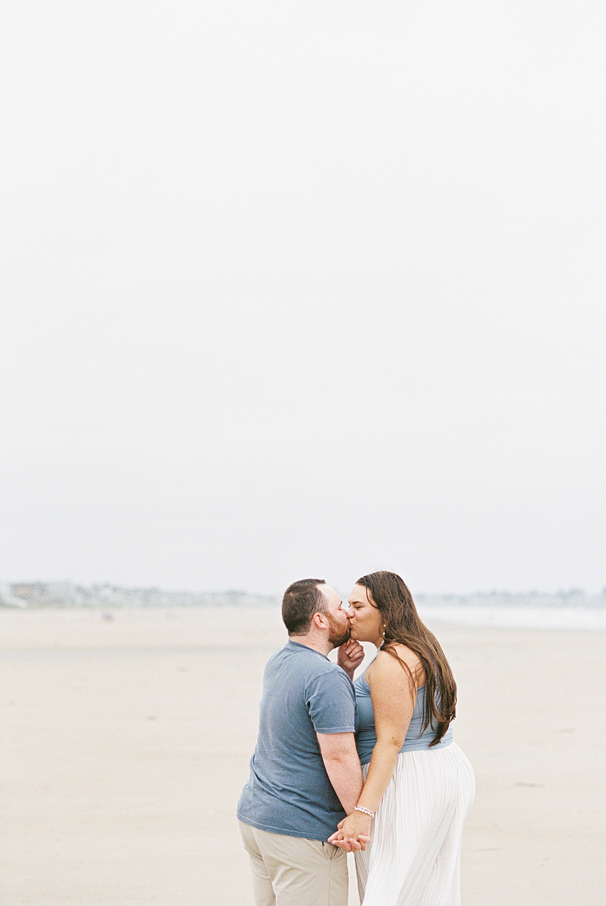 Couple share a kiss for Coastal Maine Wedding Photographer