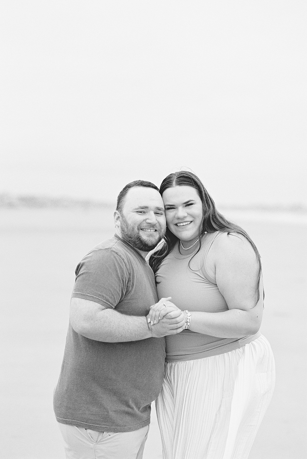 Couple cuddle in close together for Coastal Maine Wedding Photographer