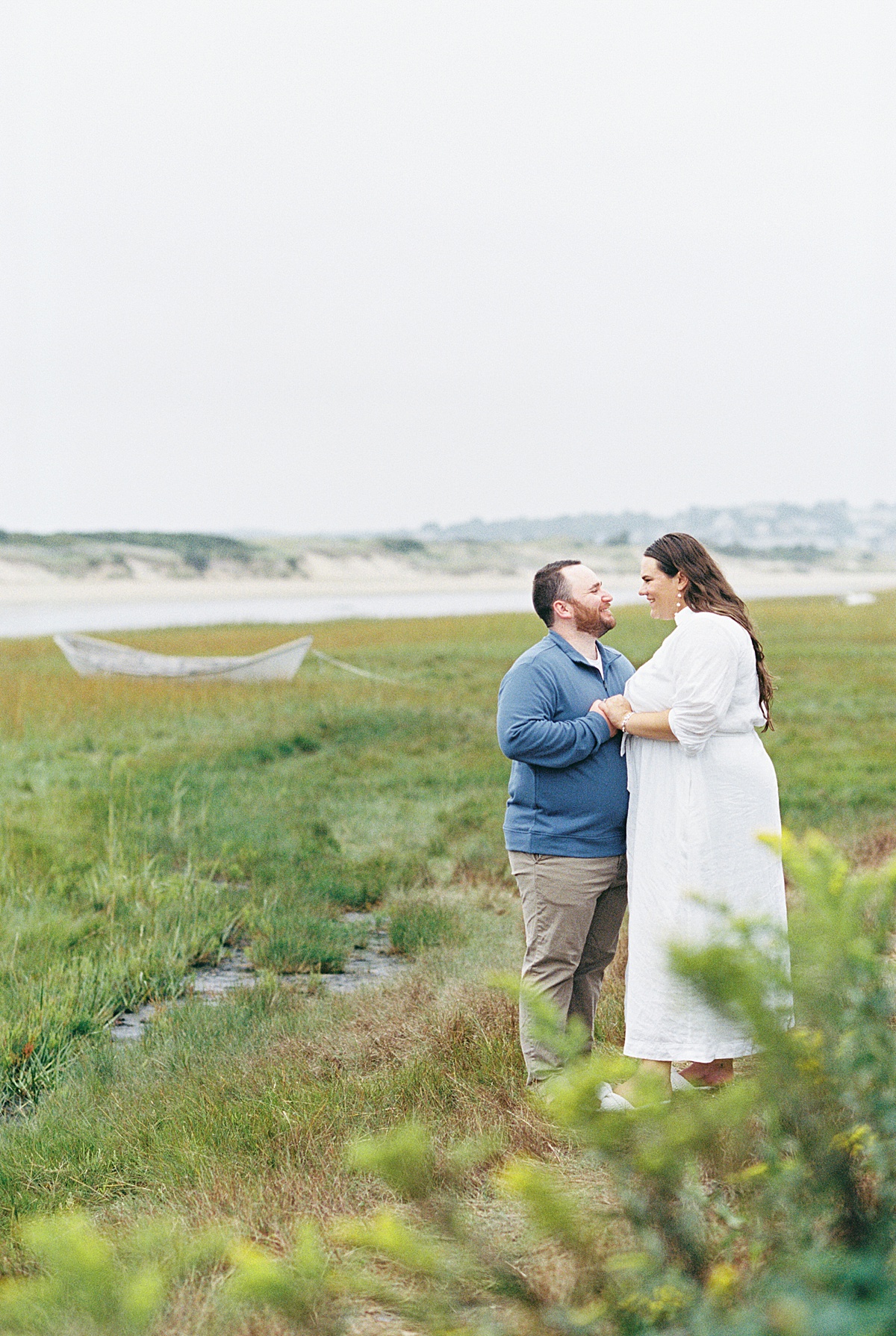 Happy couple hold each other close for Lynne Reznick Photography