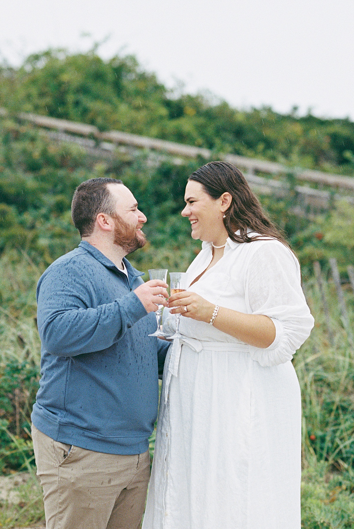 Couple celebrate with champagne on Footbridge Beach 