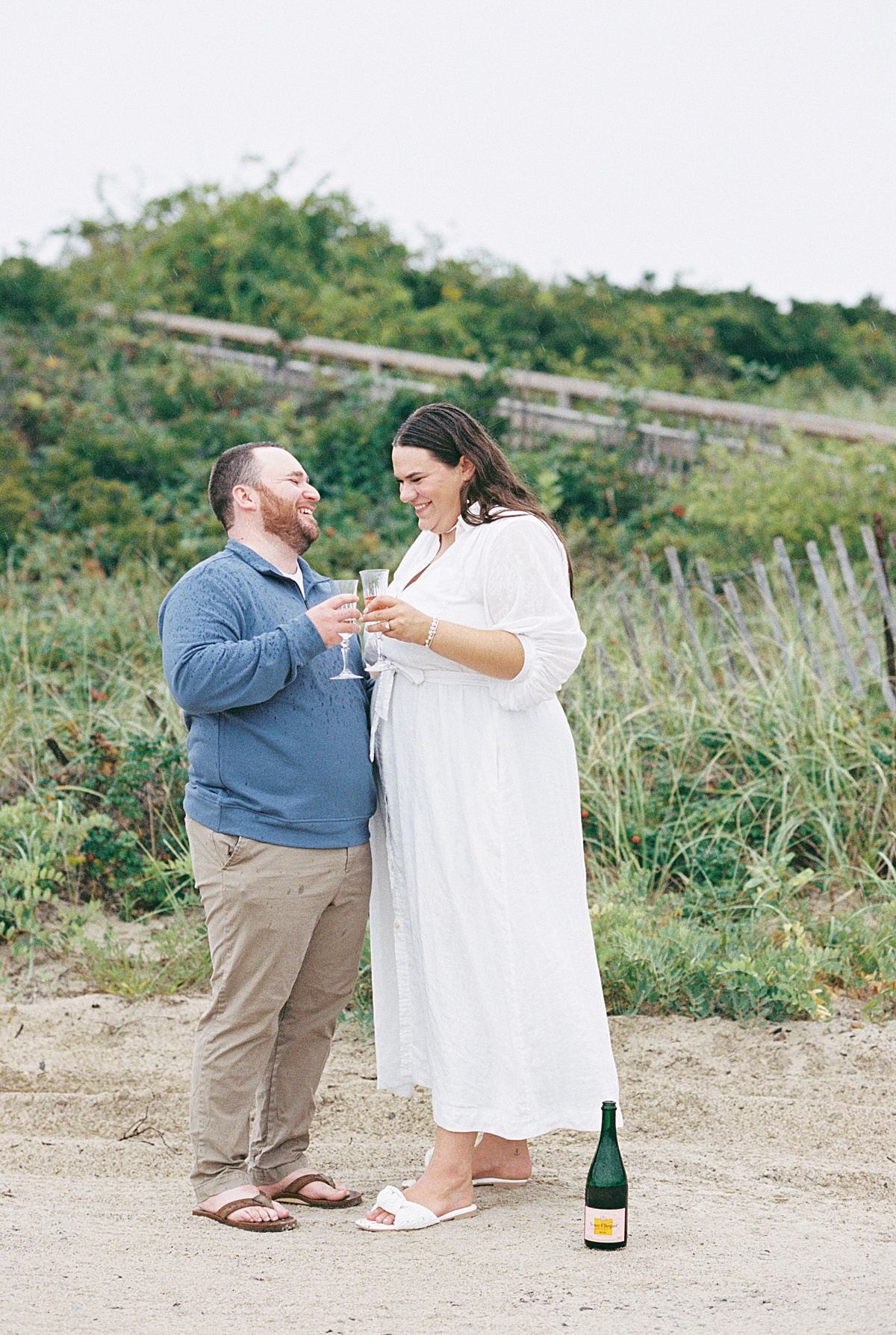 Happy couple enjoy champagne together for Coastal Maine Wedding Photographer